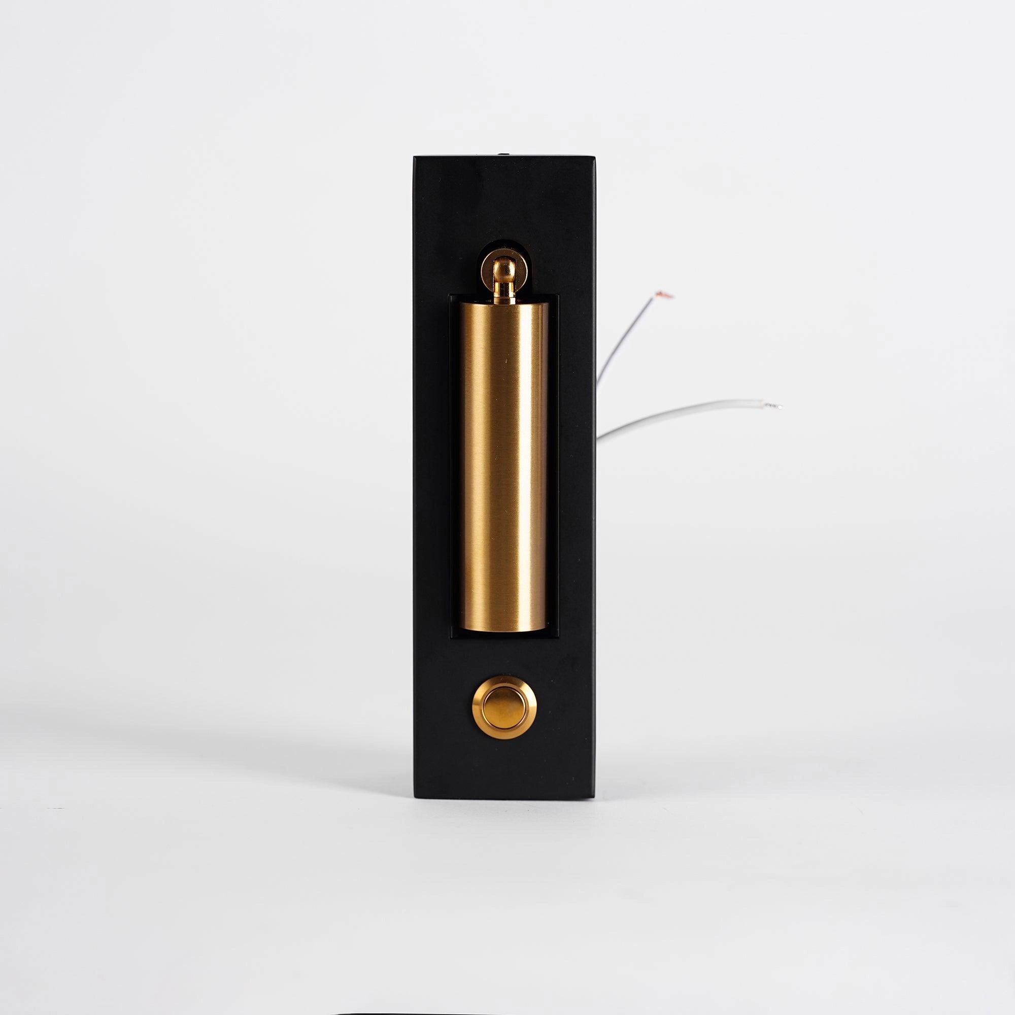 Modern adjustable black LED wall light with weather-resistant design and built-in motion sensor, mounted on an exterior wall.