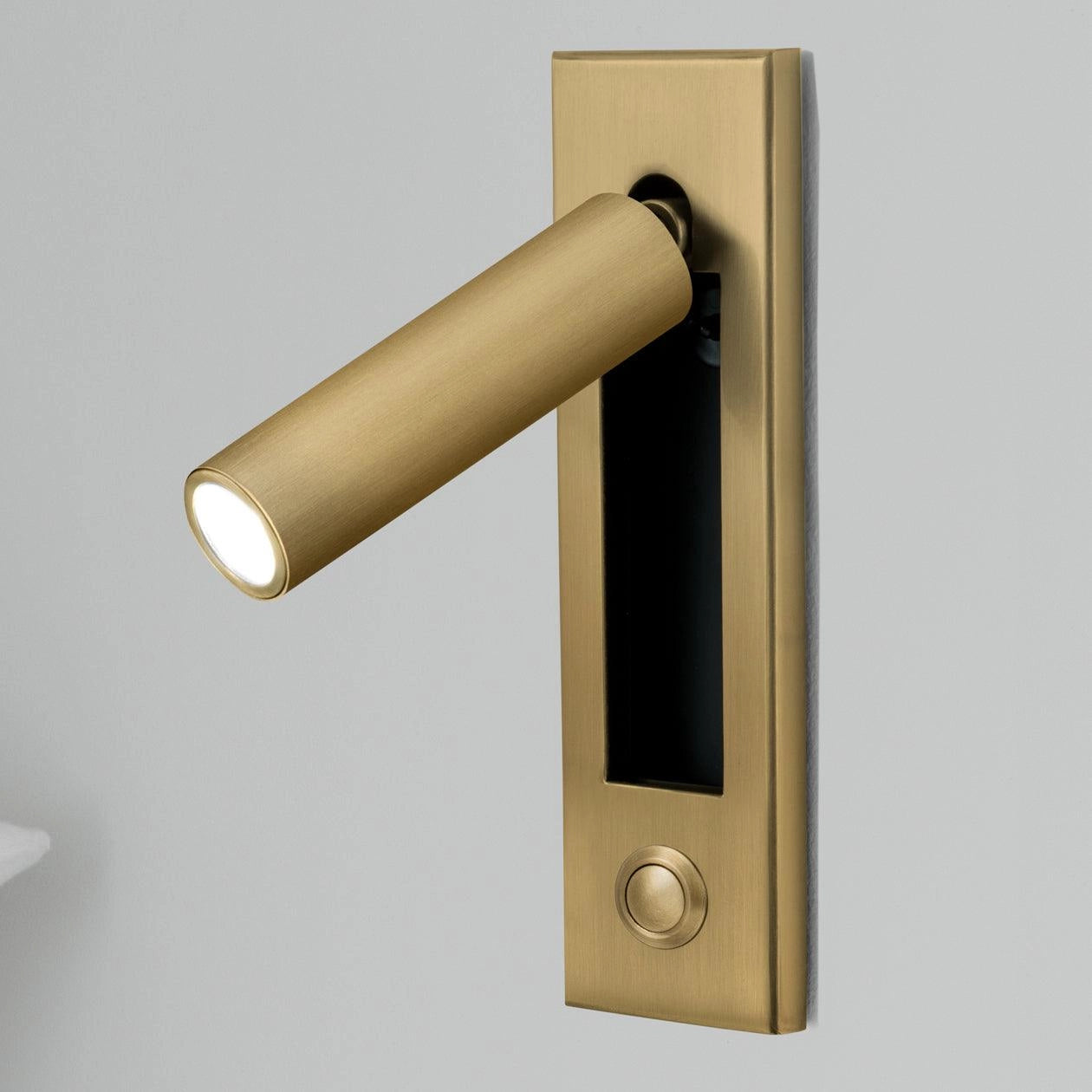 A set of two modern cylinder-shaped adjustable LED wall lights in copper finish, each measuring 5cm in diameter and 17.8cm in height, featuring a weather-resistant black exterior and a motion sensor, emitting cool white light.