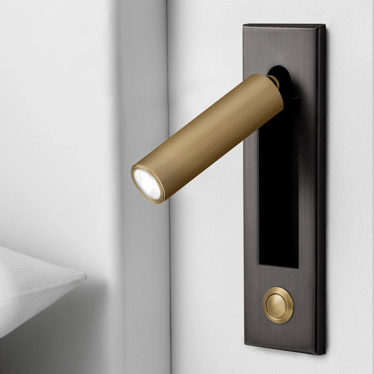 Modern adjustable LED wall lights in a weather-resistant matte black and copper finish, cylindrical design, set of 2, mounted outdoors near a door, featuring motion sensors and emitting cool white light.