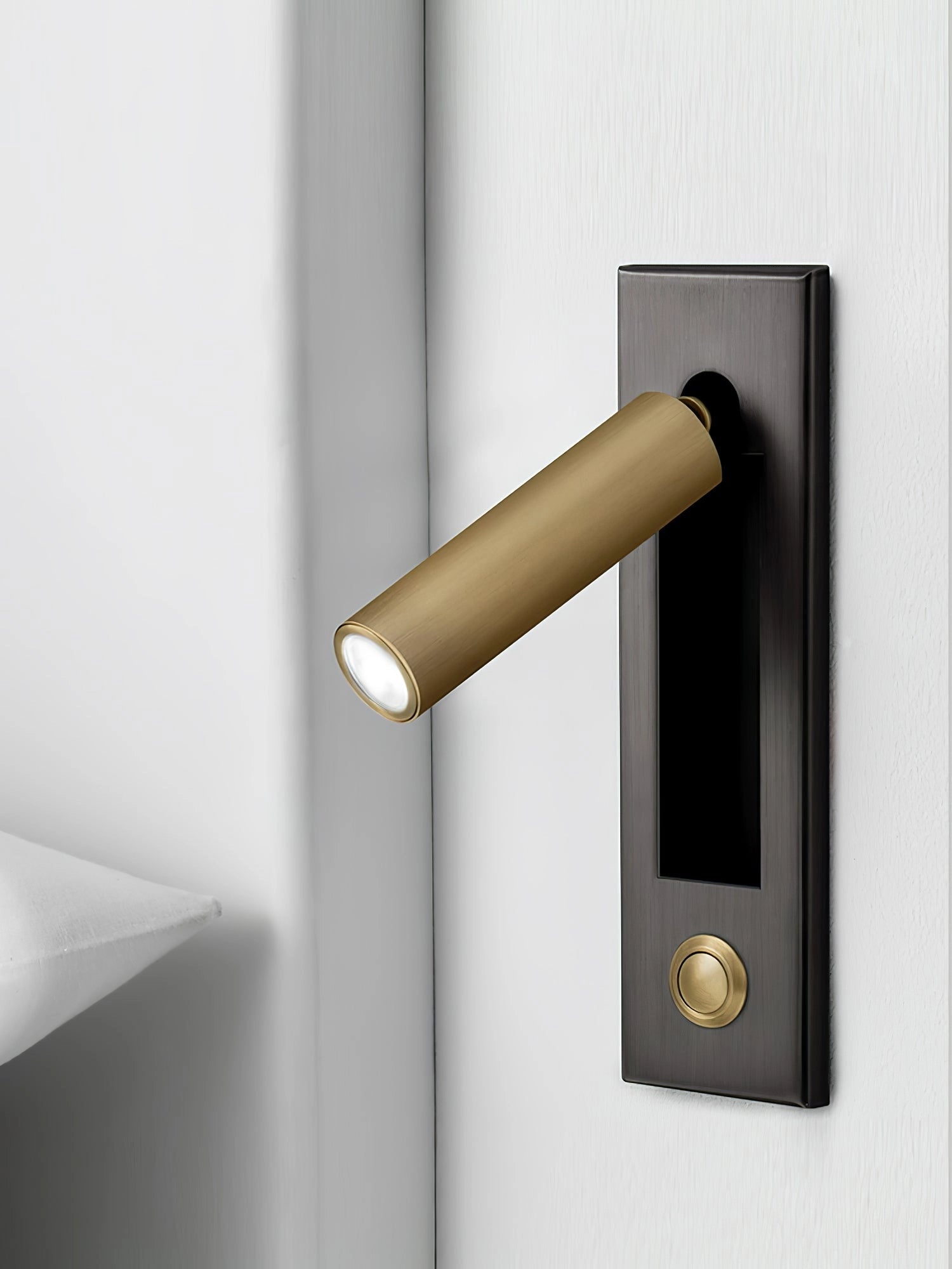 Modern black adjustable LED wall light with motion sensor, weather-resistant, mounted near a door with a rectangular design and metal fixture.