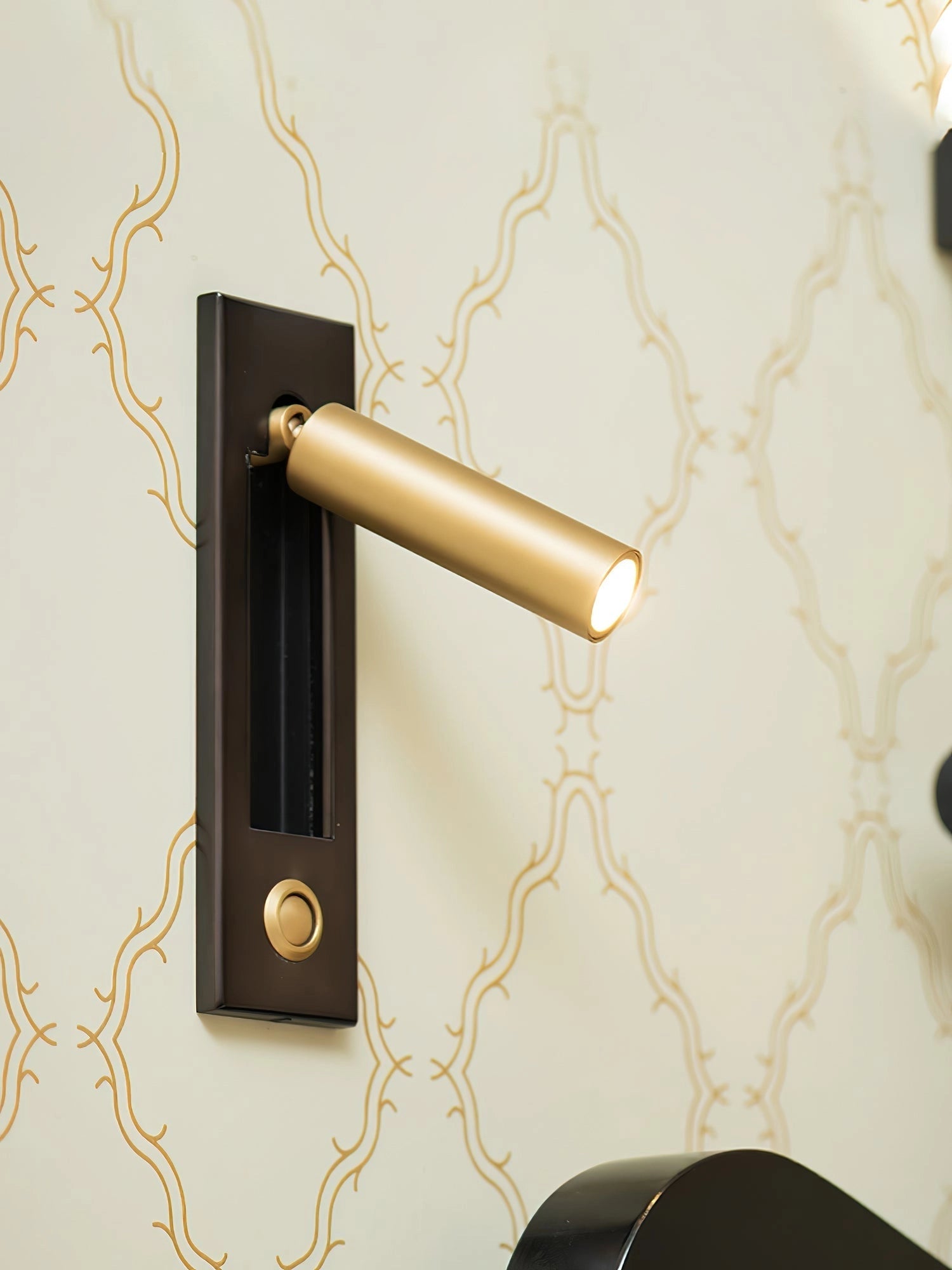 Modern adjustable black LED wall light with motion sensor mounted on a wooden wall, featuring a sleek rectangular design.