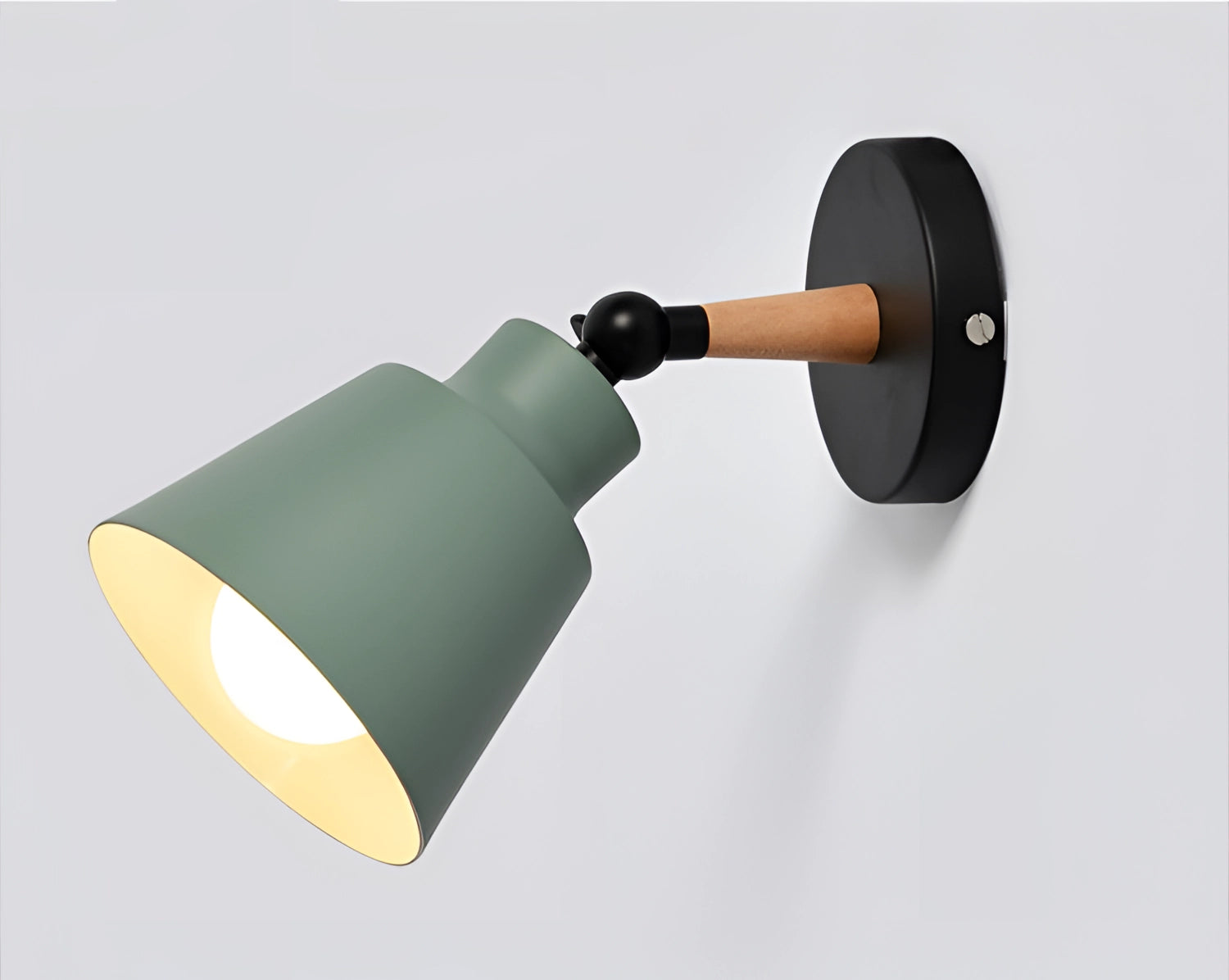 Modern adjustable matte grey sconce with wooden pivot mounted on a bedroom wall.