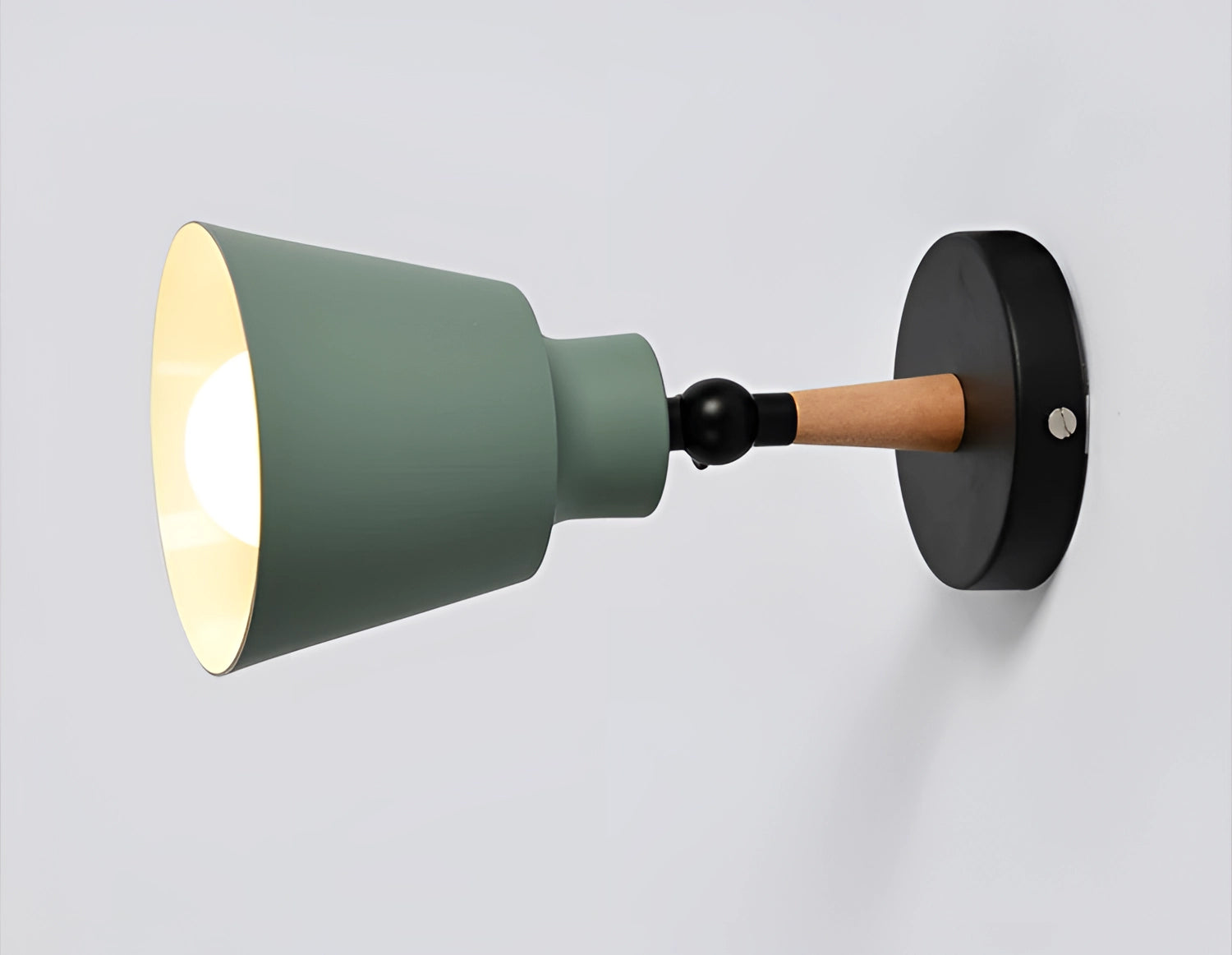 Modern adjustable matte grey sconce with wooden pivot, mounted on a bedroom wall.