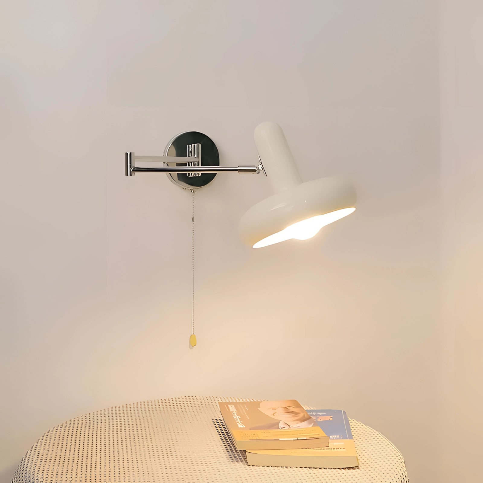 Modern adjustable reading light with minimalist white sconce and chrome finish mounted on a wooden surface, showcasing sleek metal design suitable for contemporary interiors.