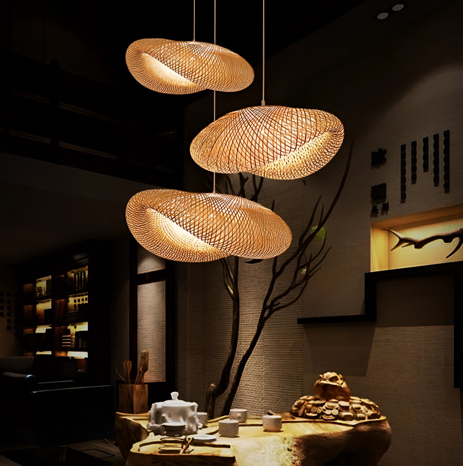 Modern bamboo pendant light fixture with an artistic wire design, illuminating a contemporary interior space.