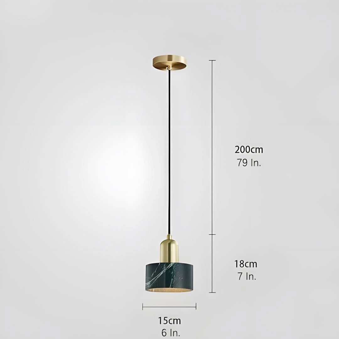 Modern bedside pendant light with gold accents and a blue velvet lampshade hanging from the ceiling.