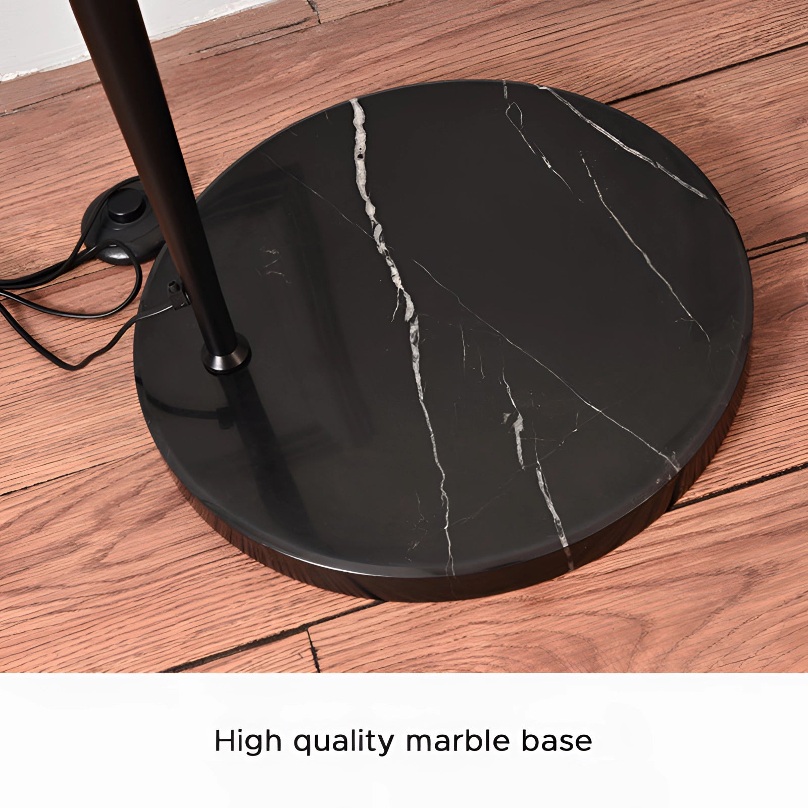 Modern black arched floor lamp with an adjustable dome head, designed for reading or focused lighting.
