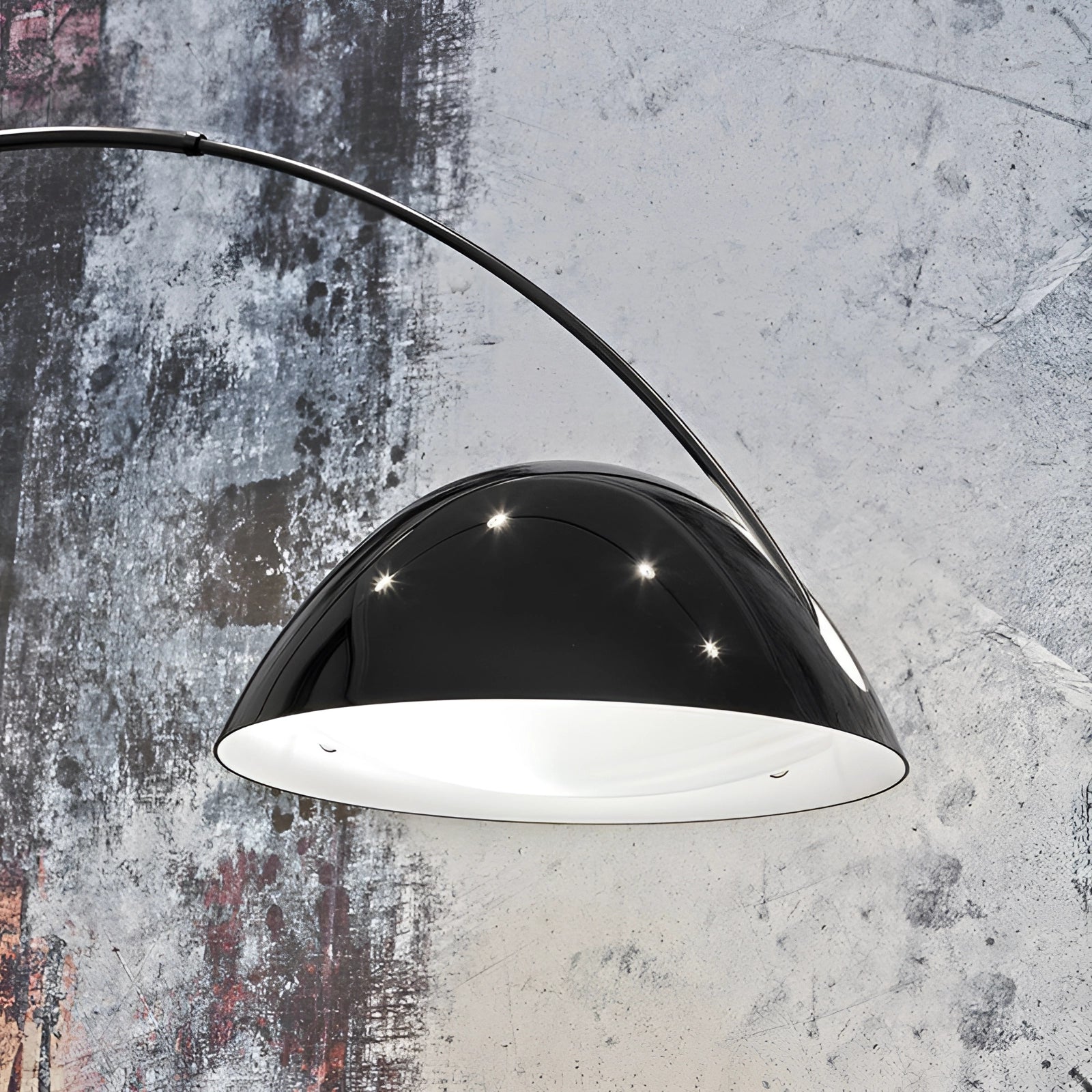 Modern black arched floor lamp featuring an adjustable dome reading light in a sleek, monochrome design.