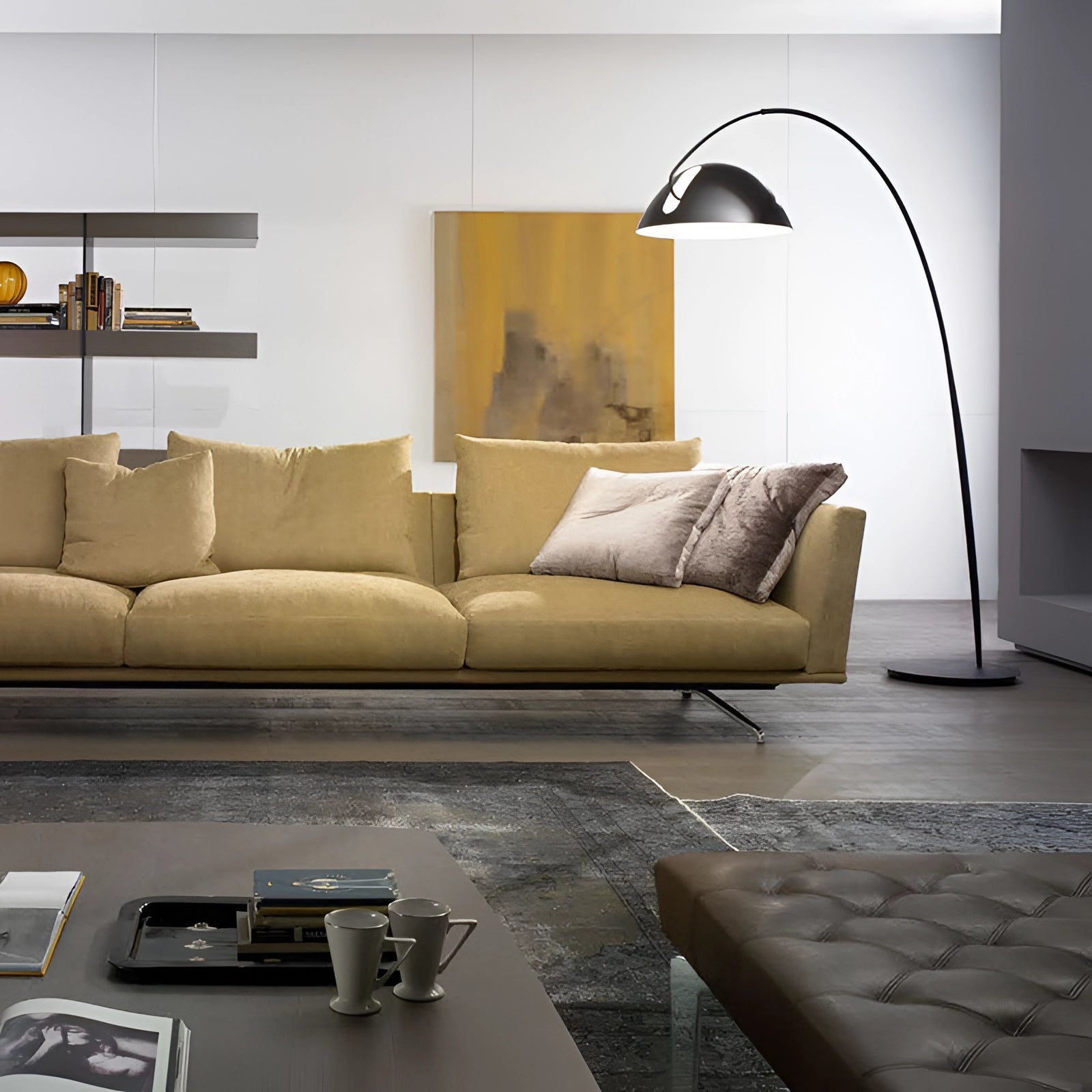Modern black arched floor lamp with adjustable dome reading light placed in a stylish living room setting featuring a cozy brown couch, a wooden rectangle table, and contemporary interior design elements.
