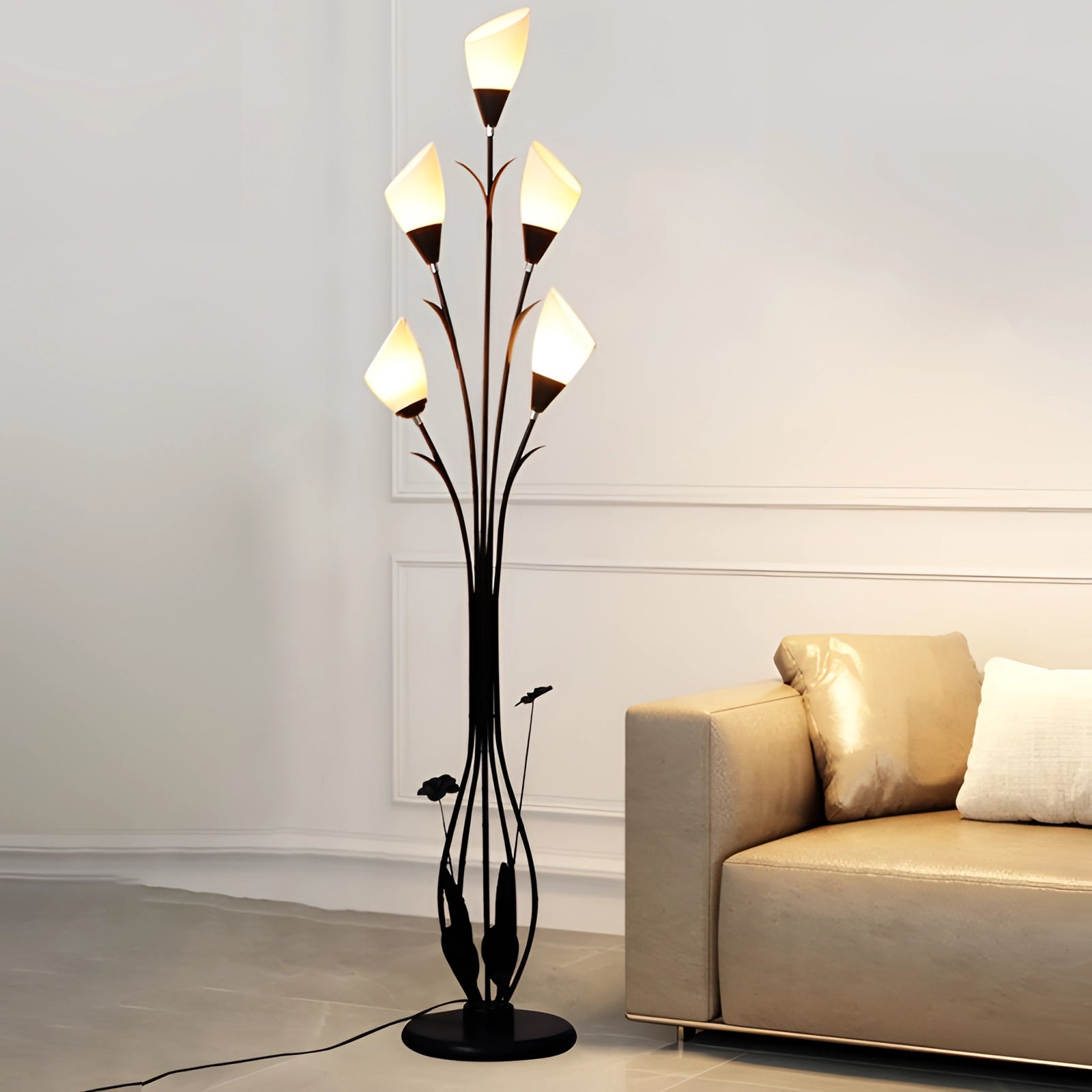 Modern black floral floor lamp with an elegant rectangular shape, featuring intricate twig-like designs, set in a stylish interior with wooden elements and decorative plants, providing ambient room lighting.