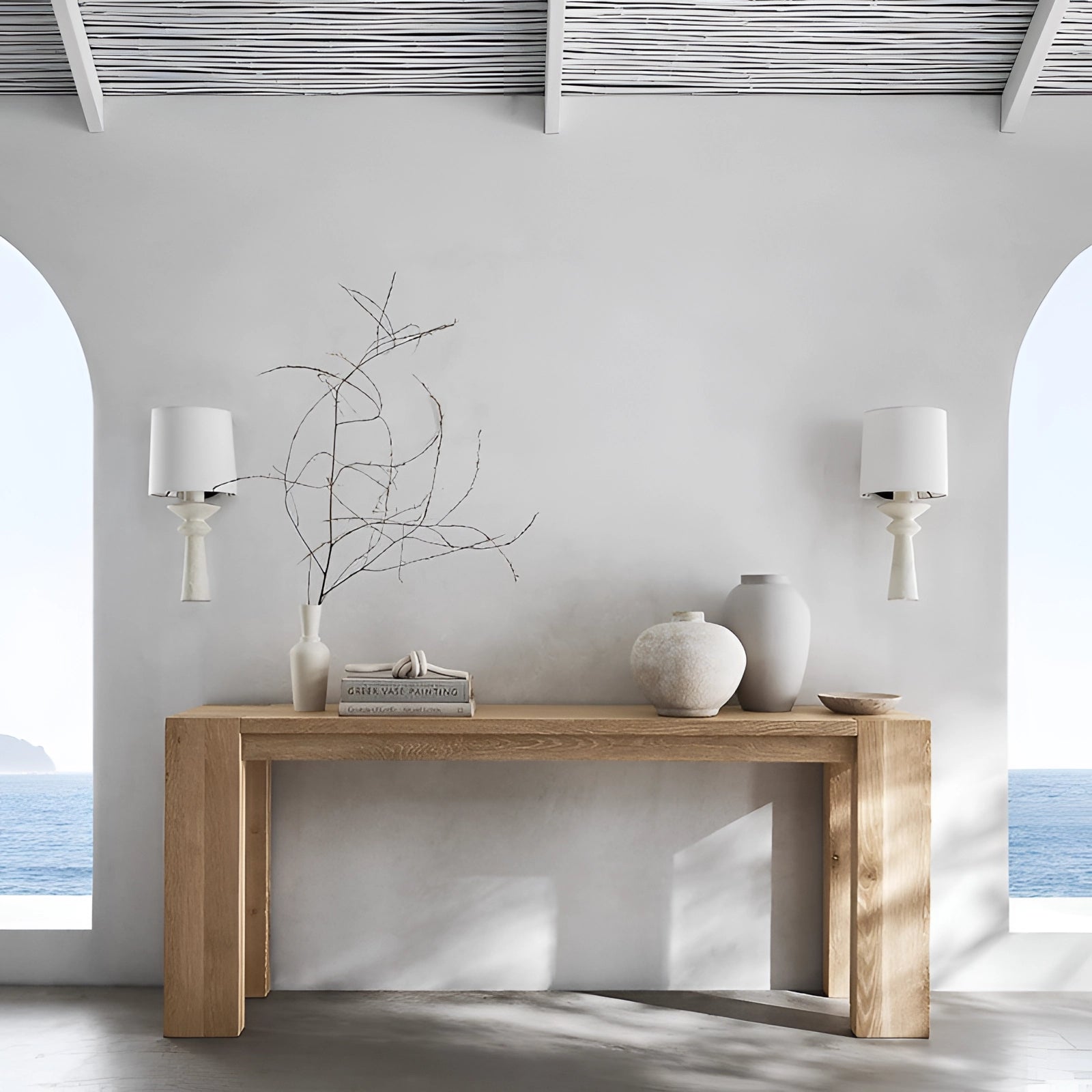 Modern black geometric table lamp with a white shade placed on a wooden table, featuring a sleek and contemporary design, suitable for interior decor in a stylish, minimalist setting.