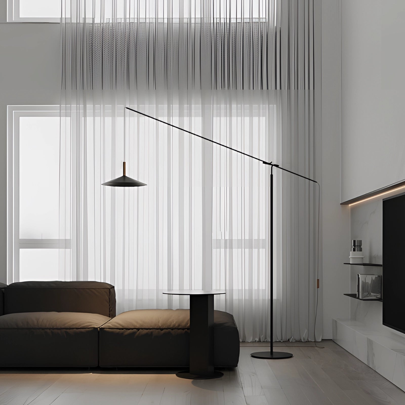 Modern black and gold adjustable designer floor lamp with a sleek, contemporary design, featuring a rectangular shade, positioned next to a grey couch in a stylish interior setting.