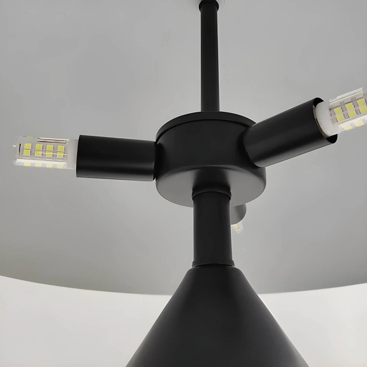 Modern black and gold geometric dome pendant light hanging from ceiling, luxury decor suitable for desks.