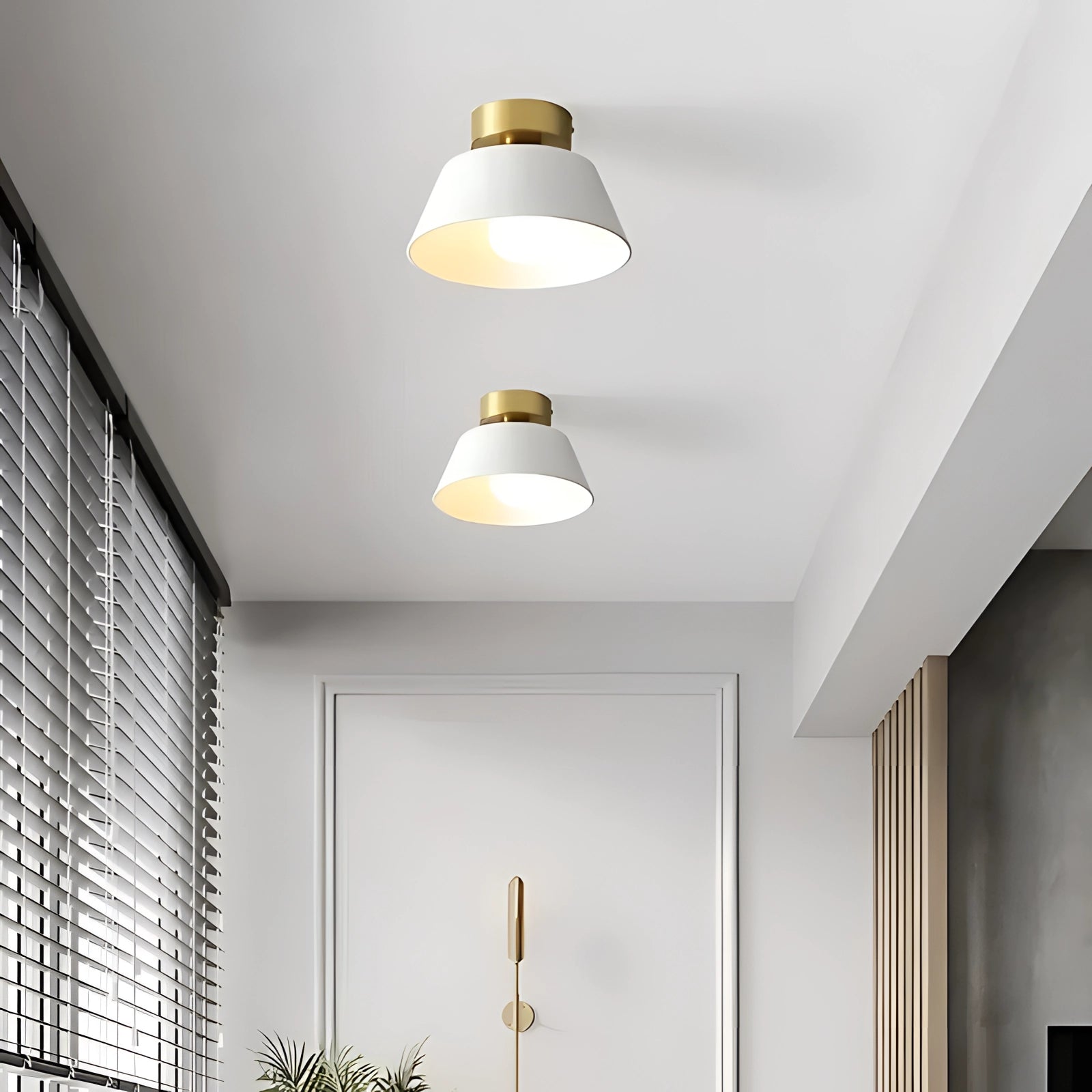 Modern black and gold LED ceiling lamp with a minimalist design, featuring a pendant light fixture hanging in a stylish interior space.