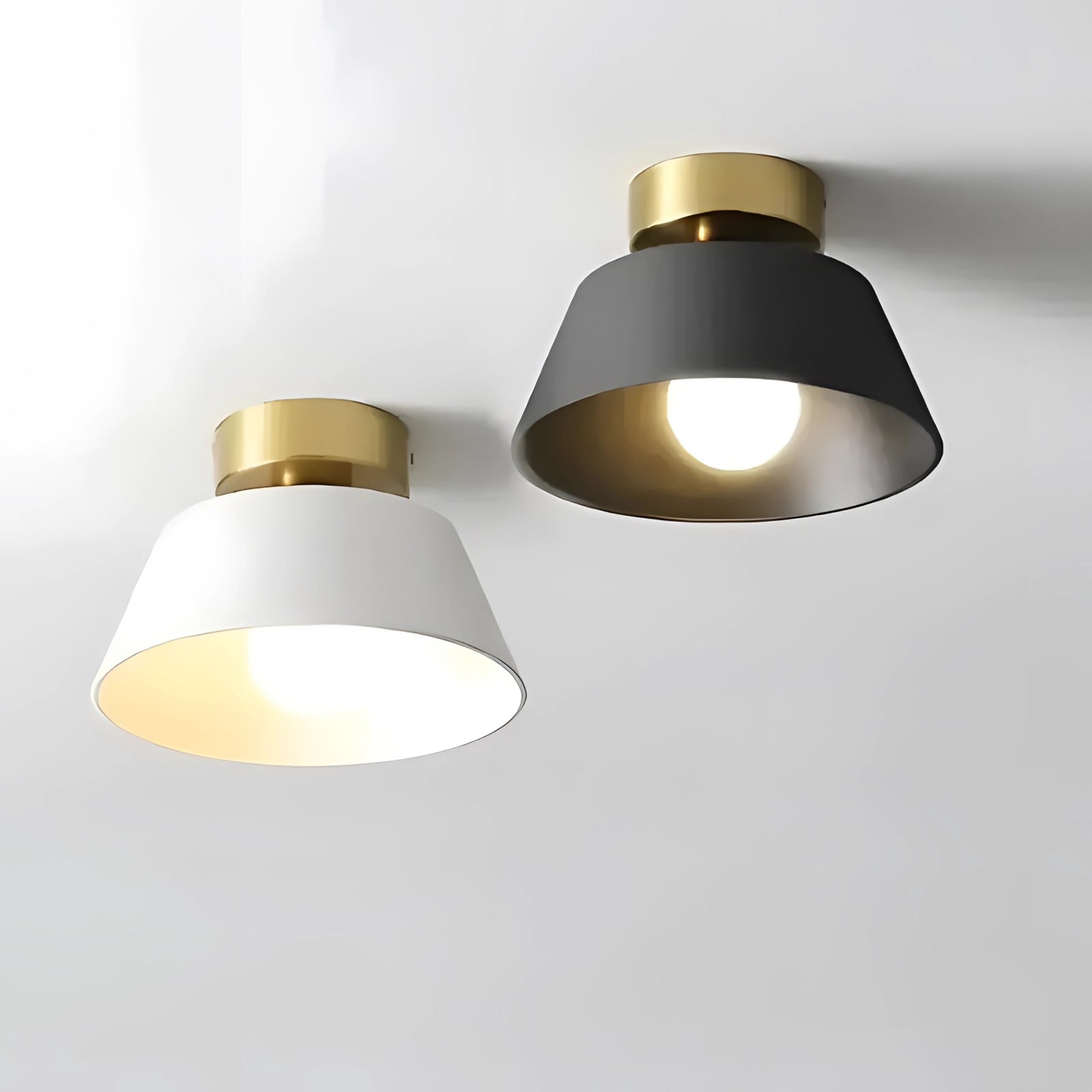 Modern black and gold LED ceiling lamp with a minimalist design, featuring a circular metal frame and an amber-tinted light bulb, ideal as a pendant light for contemporary interiors.