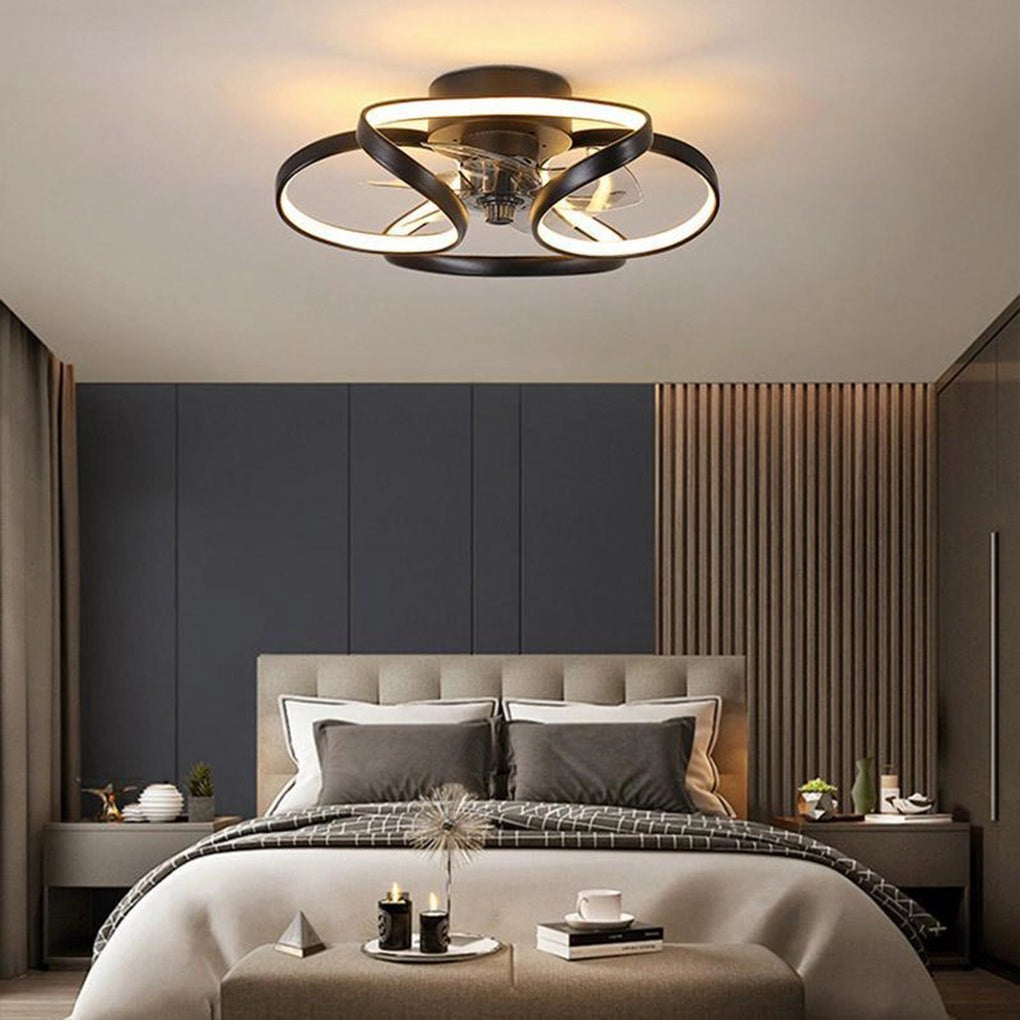 Modern black LED ceiling fan with light and remote installed in a stylish bedroom with wood and brown furniture, adding comfort and decorative lighting.