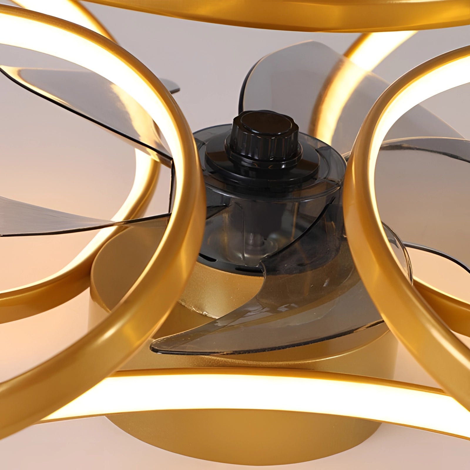 Modern black LED ceiling fan with light and remote mounted on a bedroom ceiling.