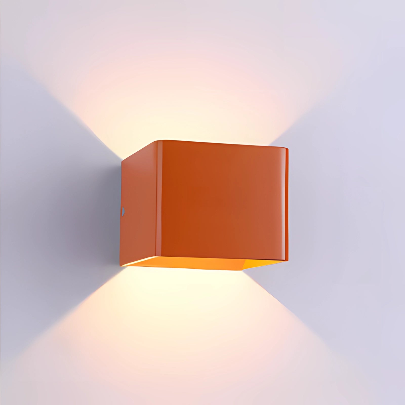 Orange geometric modern black LED wall sconce with a rectangular design, featuring amber and magenta accents, suitable as an exterior lighting fixture.