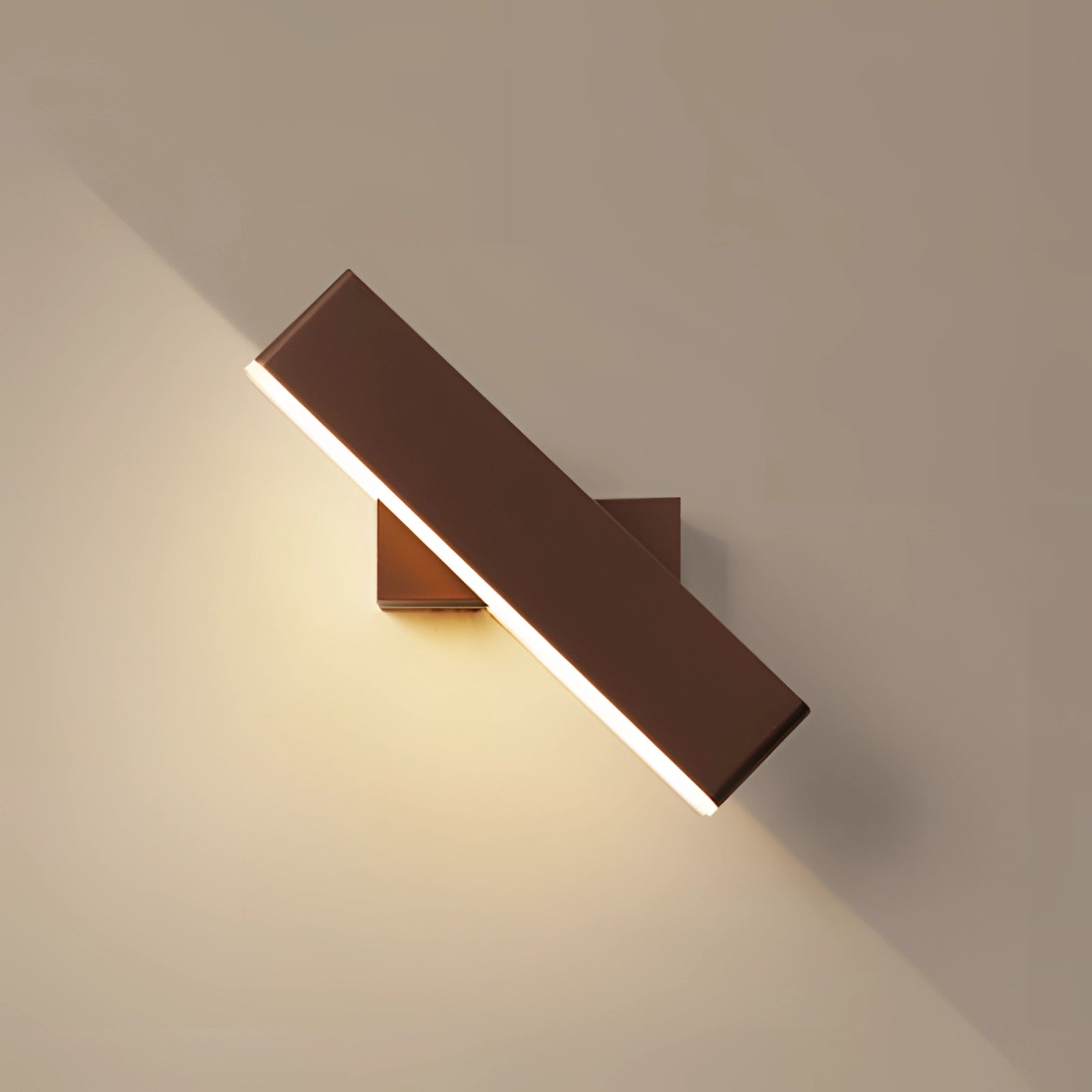 Modern black LED wall sconce with a minimalist geometric design, featuring a rectangular shape and a combination of metal and wood materials, mounted on a wall with surrounding tints and shades that highlight its sleek aesthetic.