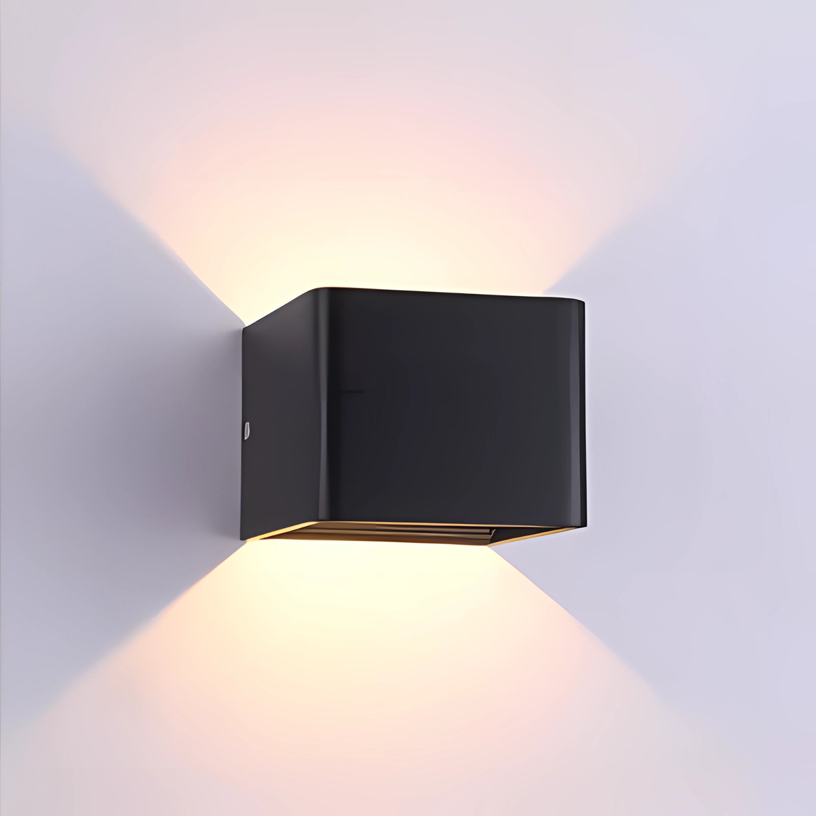 Modern black LED wall sconce with a geometric design, mounted on a wooden surface, providing ambient lighting.