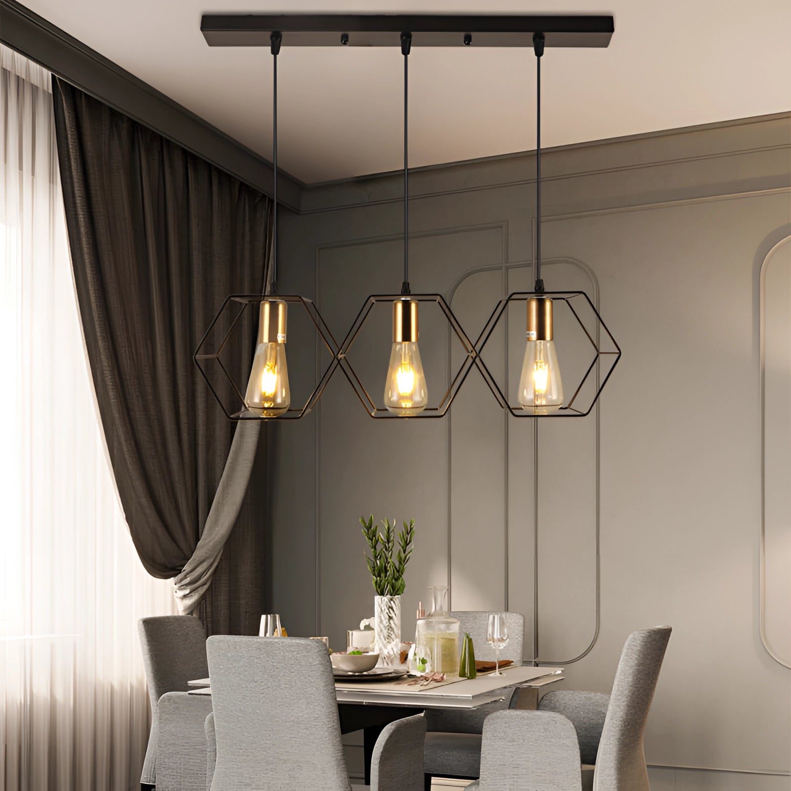 Modern black metal geometric five-light pendant chandelier hanging above a wooden table in a stylish living room setting with a couch, decorative textiles, and indoor plants.