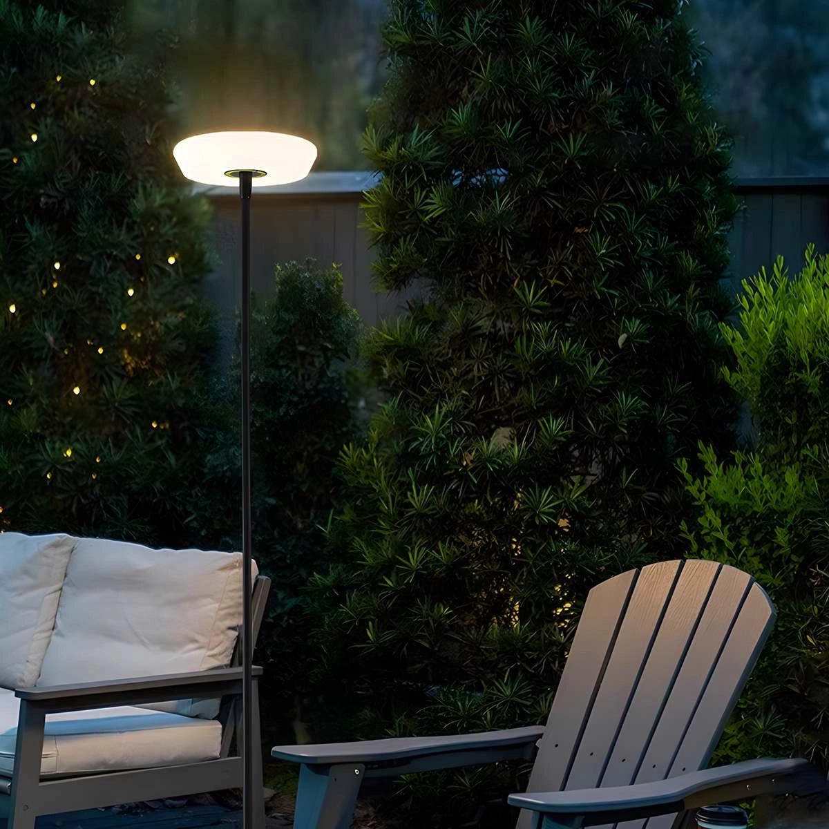 A modern black minimalist LED torchiere floor lamp with a slim, energy-efficient design, standing in a stylish indoor setting.