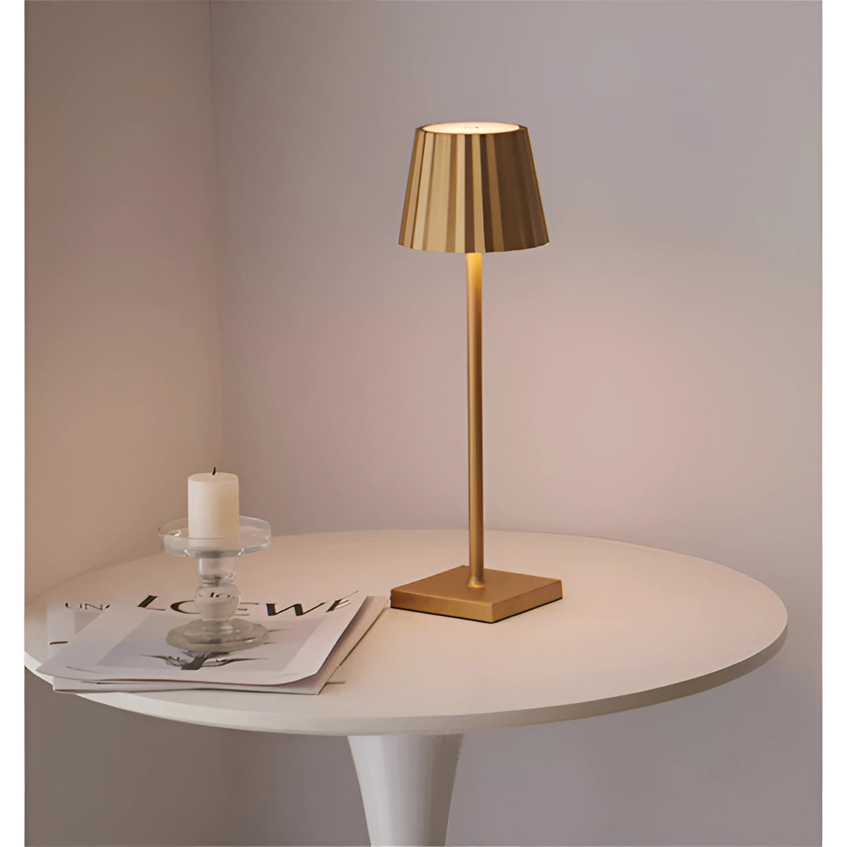 Modern black minimalist table lamp with a slim profile and elegant light, featuring a gold accent. The lamp is placed on a wooden table, showcasing its rectangular base crafted from composite materials and plywood, complementing the minimalist aesthetic.