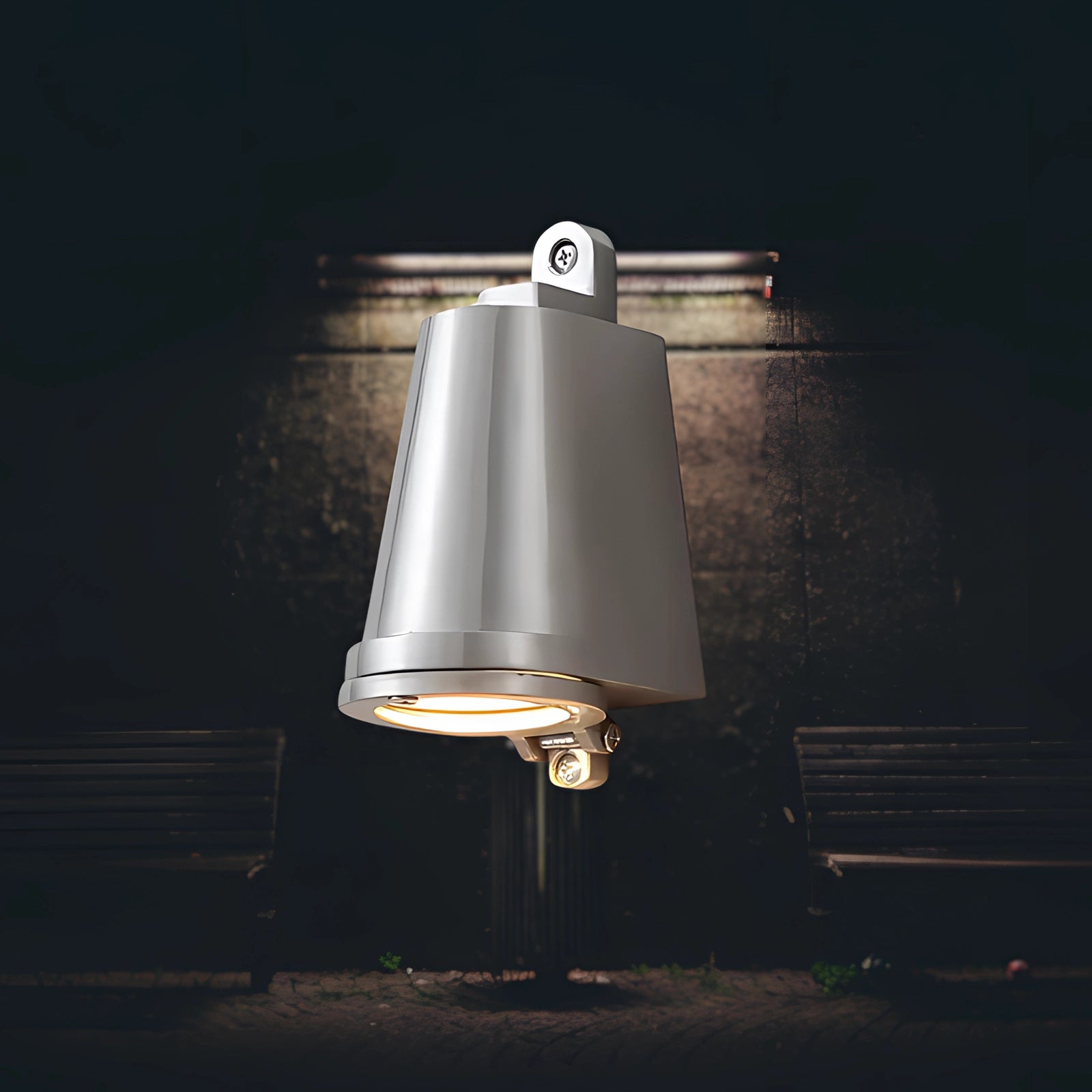 Modern black outdoor wall light in a sleek design, featuring a weather-resistant LED fixture with a silver finish and emitting cool white light.