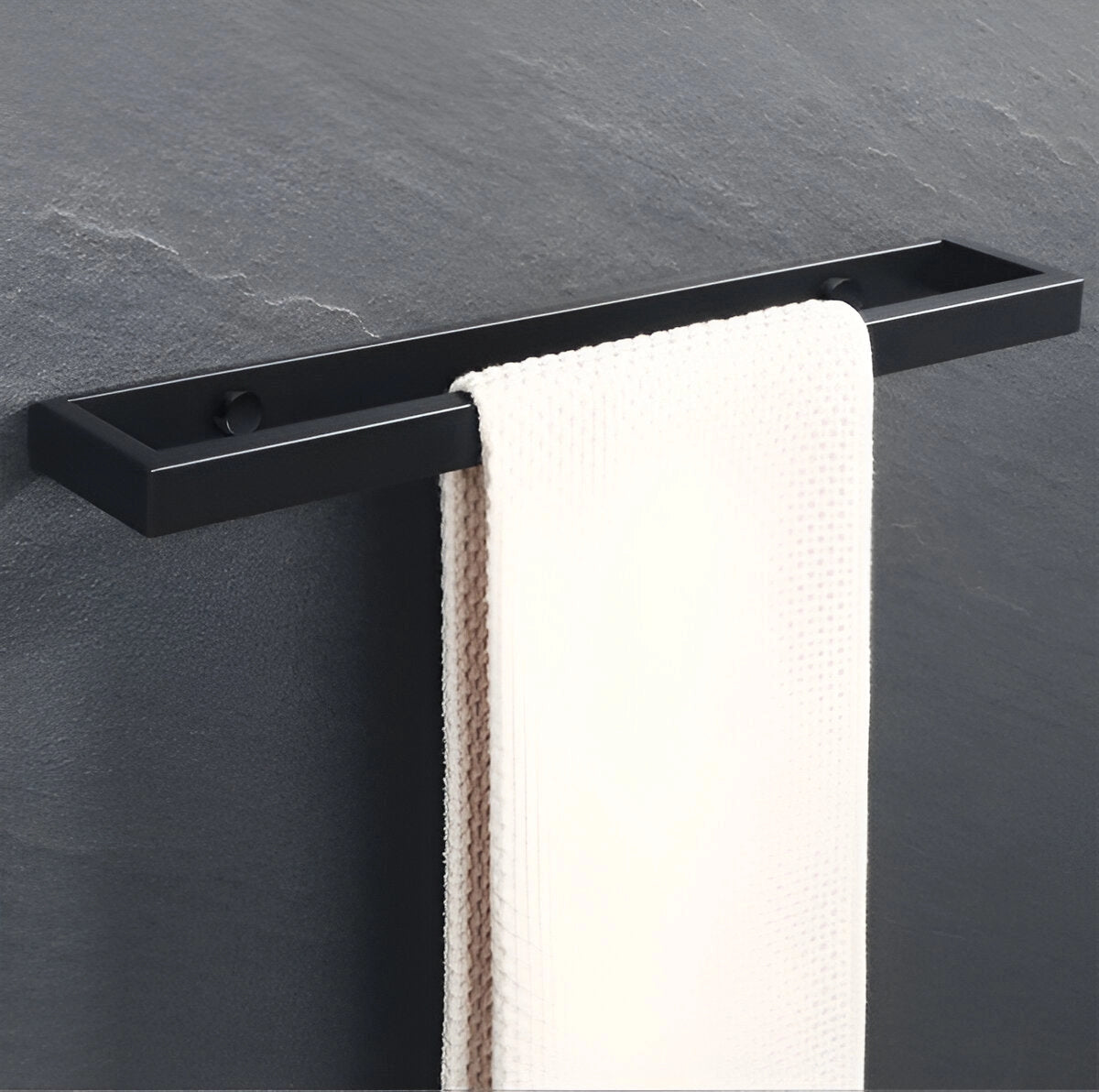 Modern black wall-mounted towel bar displayed against a neutral background, showcasing its sleek metal design and luxurious finish, ideal for contemporary bathrooms.