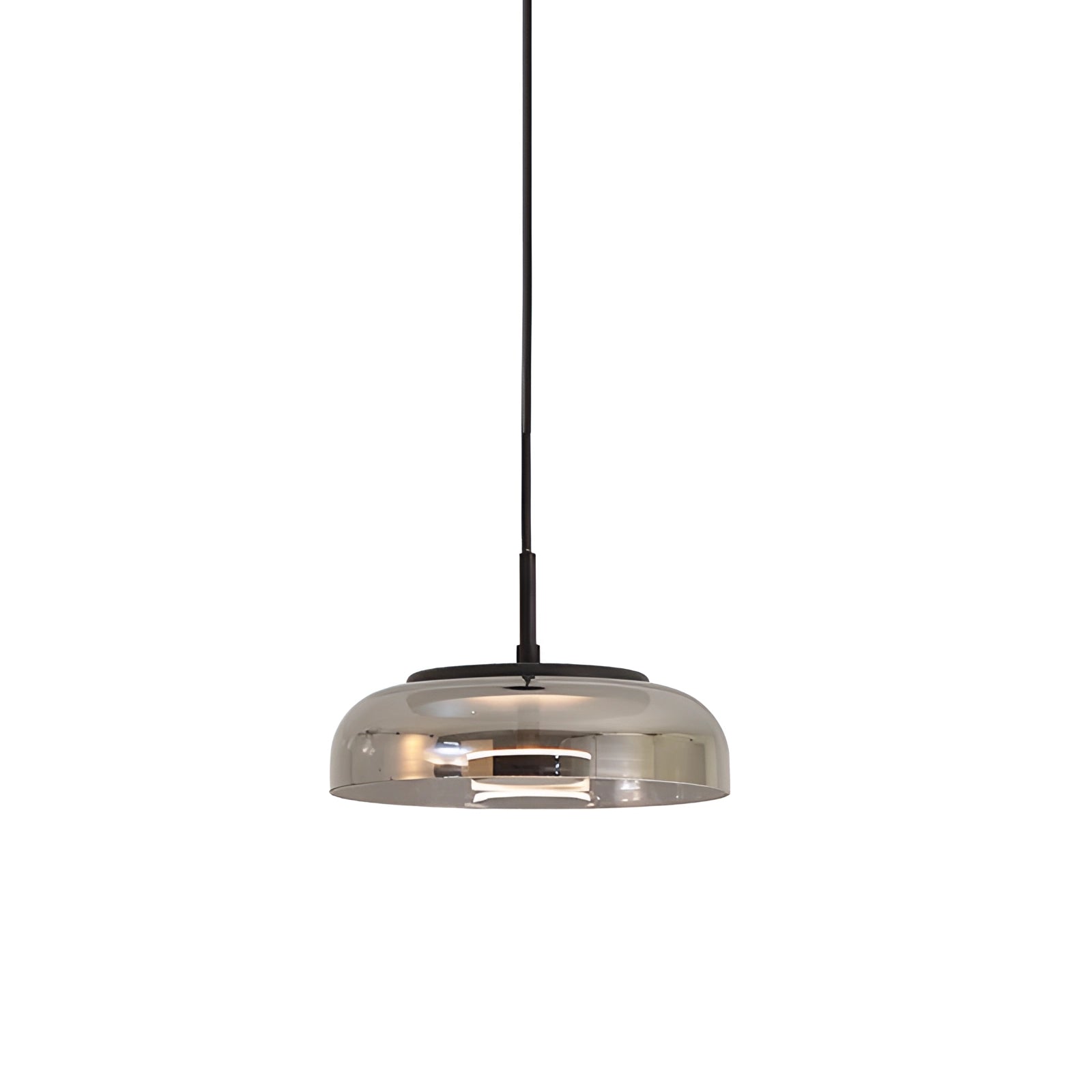 Modern brass and chrome LED pendant light with cool light, featuring a luxury minimalist design in messing and smoke gray, measures ∅ 9″ x H 7.9″, hanging from a ceiling, highlighting metal and wood elements.