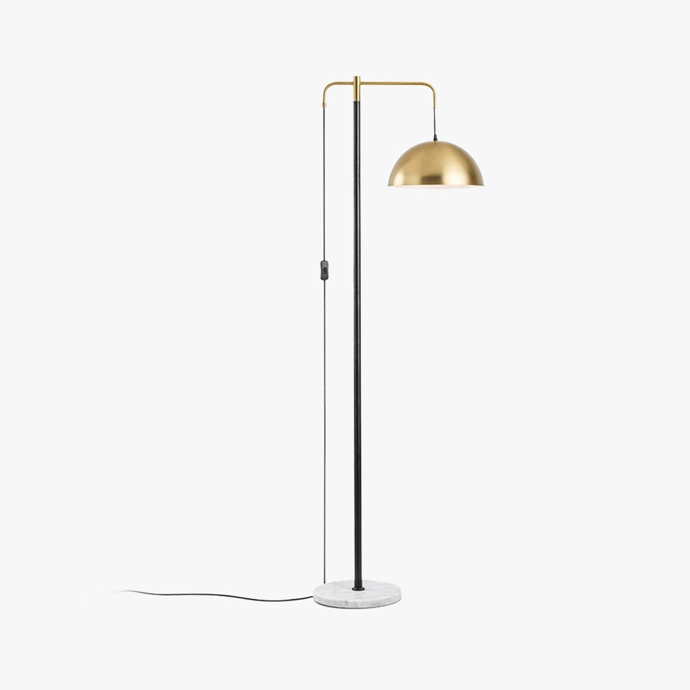 Modern brass dome shade floor lamp with gold-tone adjustable lighting, featuring a sleek design suitable for home interiors.