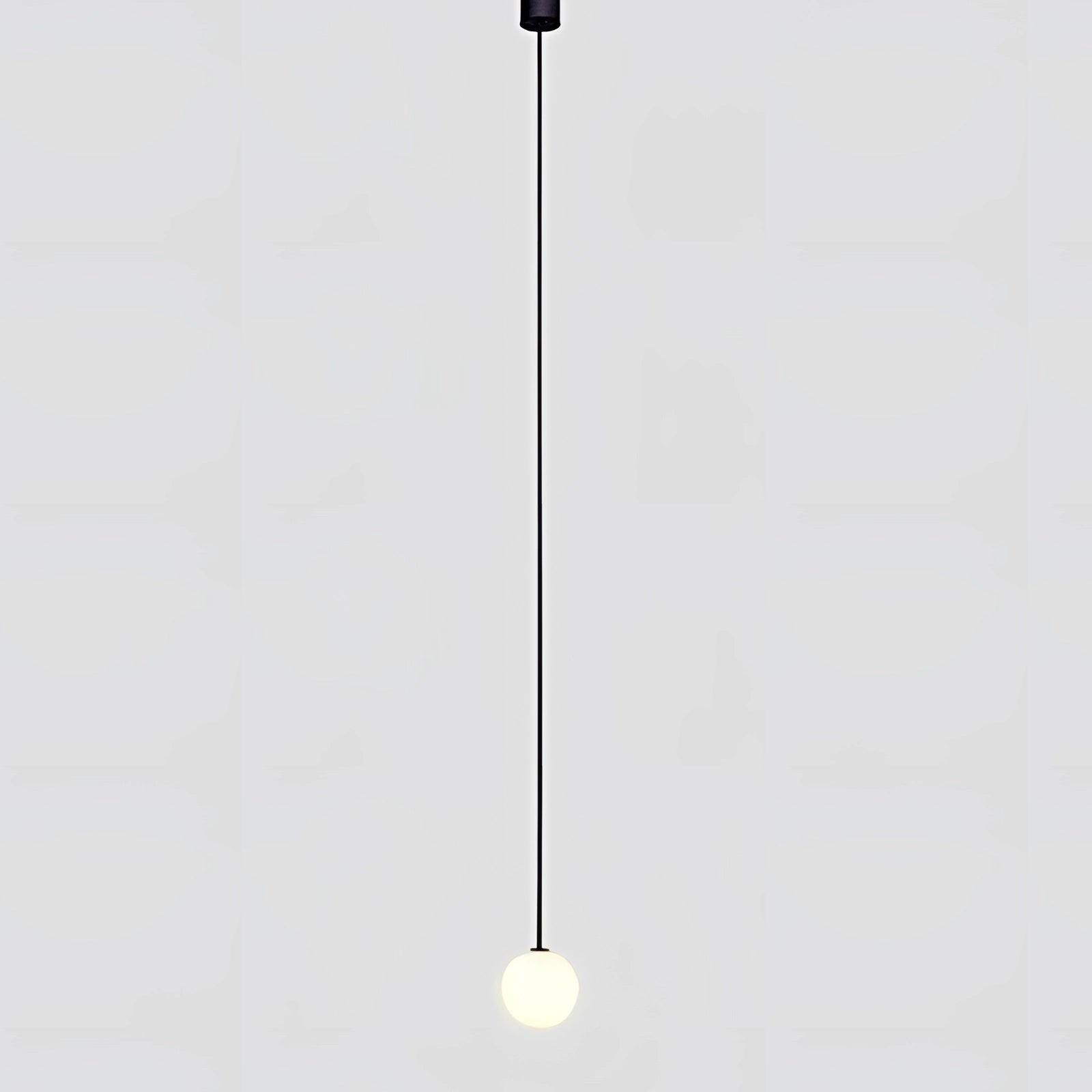 Modern brass globe pendant light with a minimalist design, featuring a round, symmetrical shape, ideal for luxury kitchen decor.