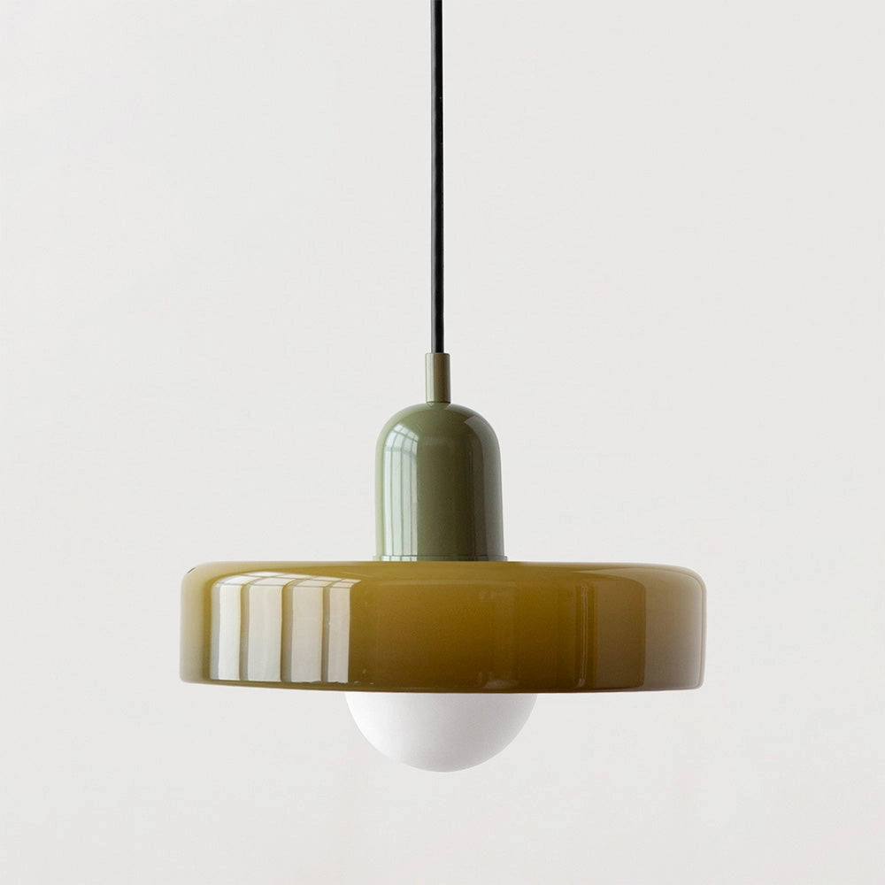 Modern brass pendant light with adjustable red cable, hanging from ceiling, featuring a metal and wood design.