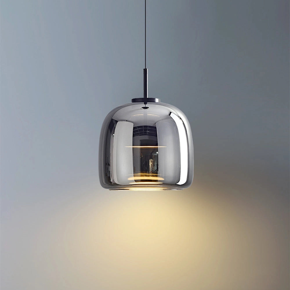 Stylish modern brushed brass glass pendant light hanging from the ceiling, ideal for kitchens and dining areas, featuring a sleek rectangular design.