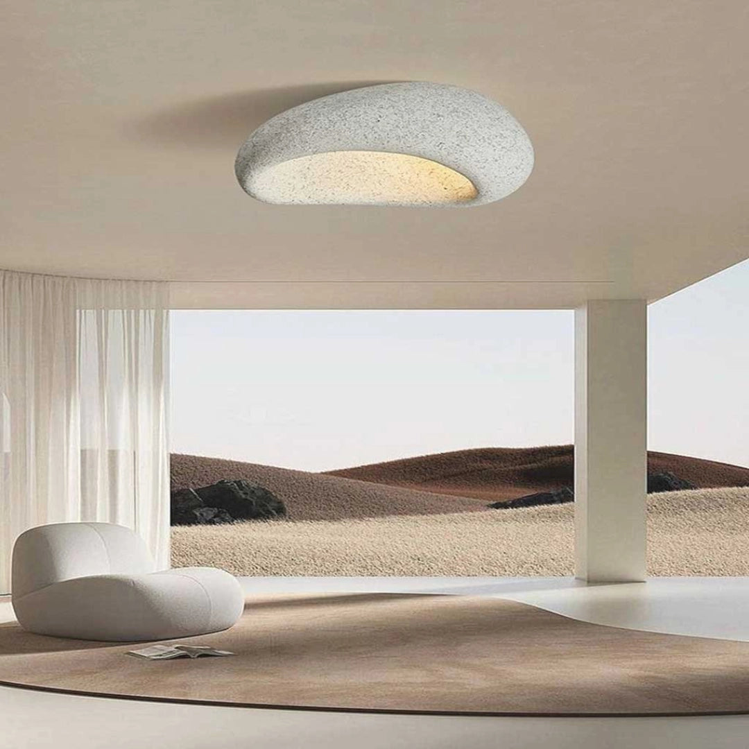 Modern minimalist ceiling lamp with a rectangular beige shade, featuring wooden accents. The lamp is designed to provide warm ambient lighting, enhancing comfort and style in interior spaces.