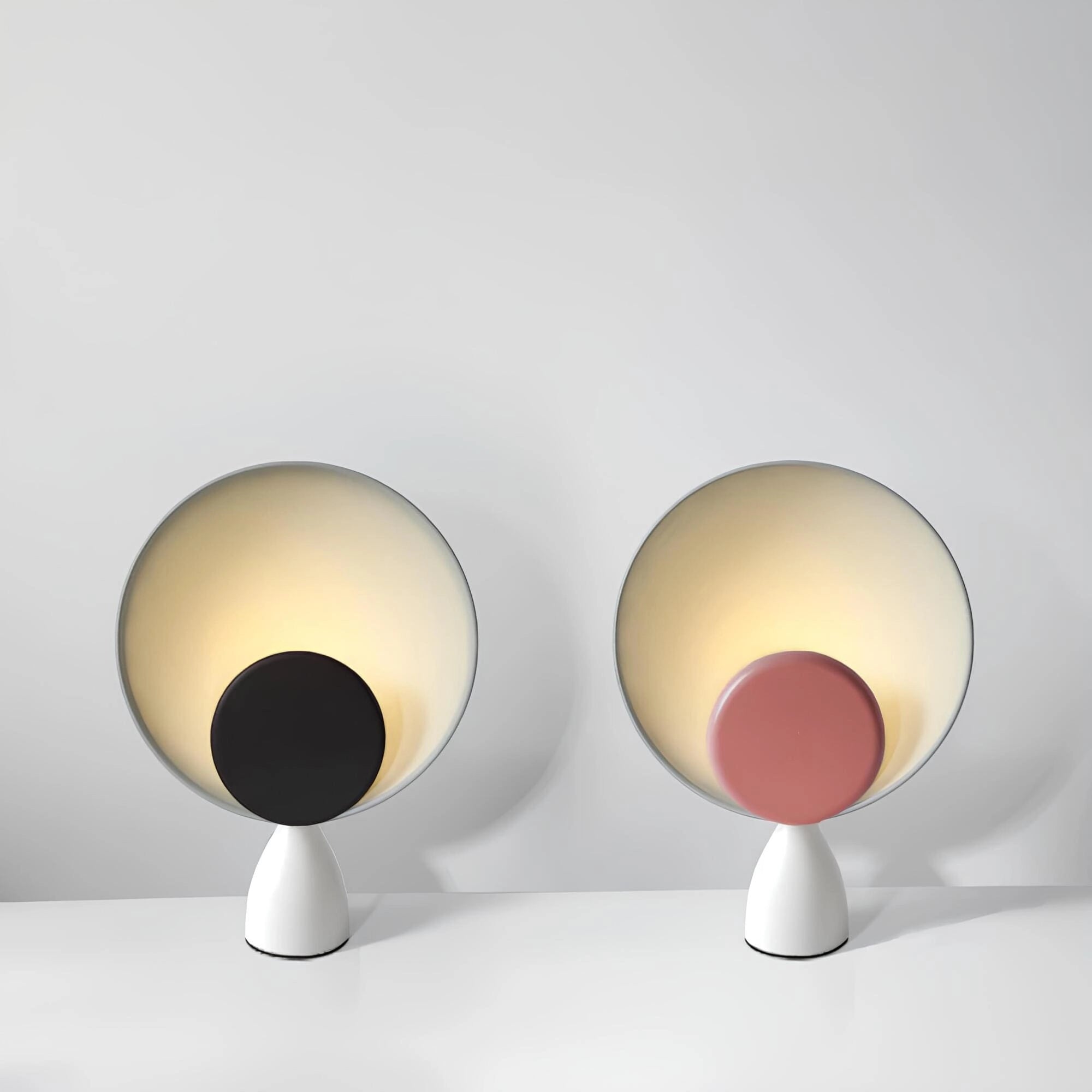 Modern circular acoustic speaker with a sleek design, featuring a metallic finish and symmetrical pattern, ideal for a stylish home audio system.