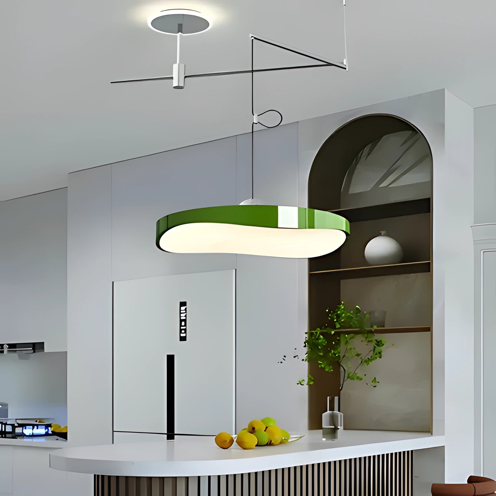 Modern circular LED pendant light in green, 50cm size, hanging in a stylish kitchen setting with plants on shelves for a contemporary interior design.