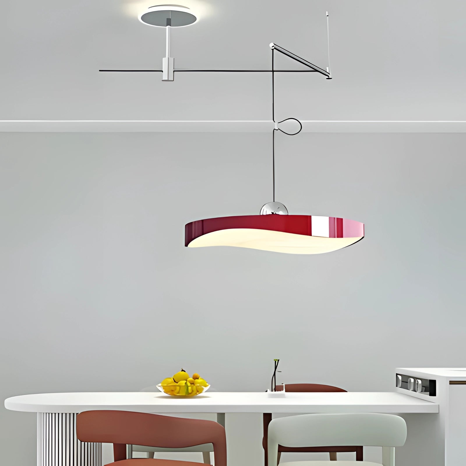 Modern circular LED pendant light fixture in red, 50cm size, hanging above a dining or kitchen area with contemporary furniture and interior design elements.