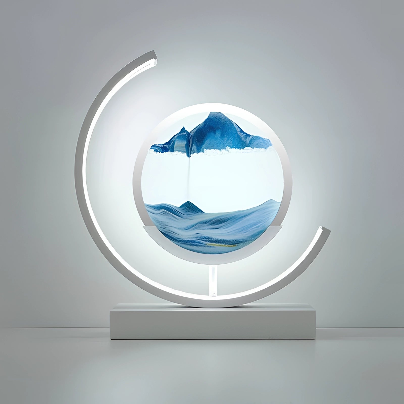 Modern circular LED sculpture featuring an eco-friendly design in white and electric blue, resembling a contemporary art piece with a moon-like circle and sleek geometric elements.