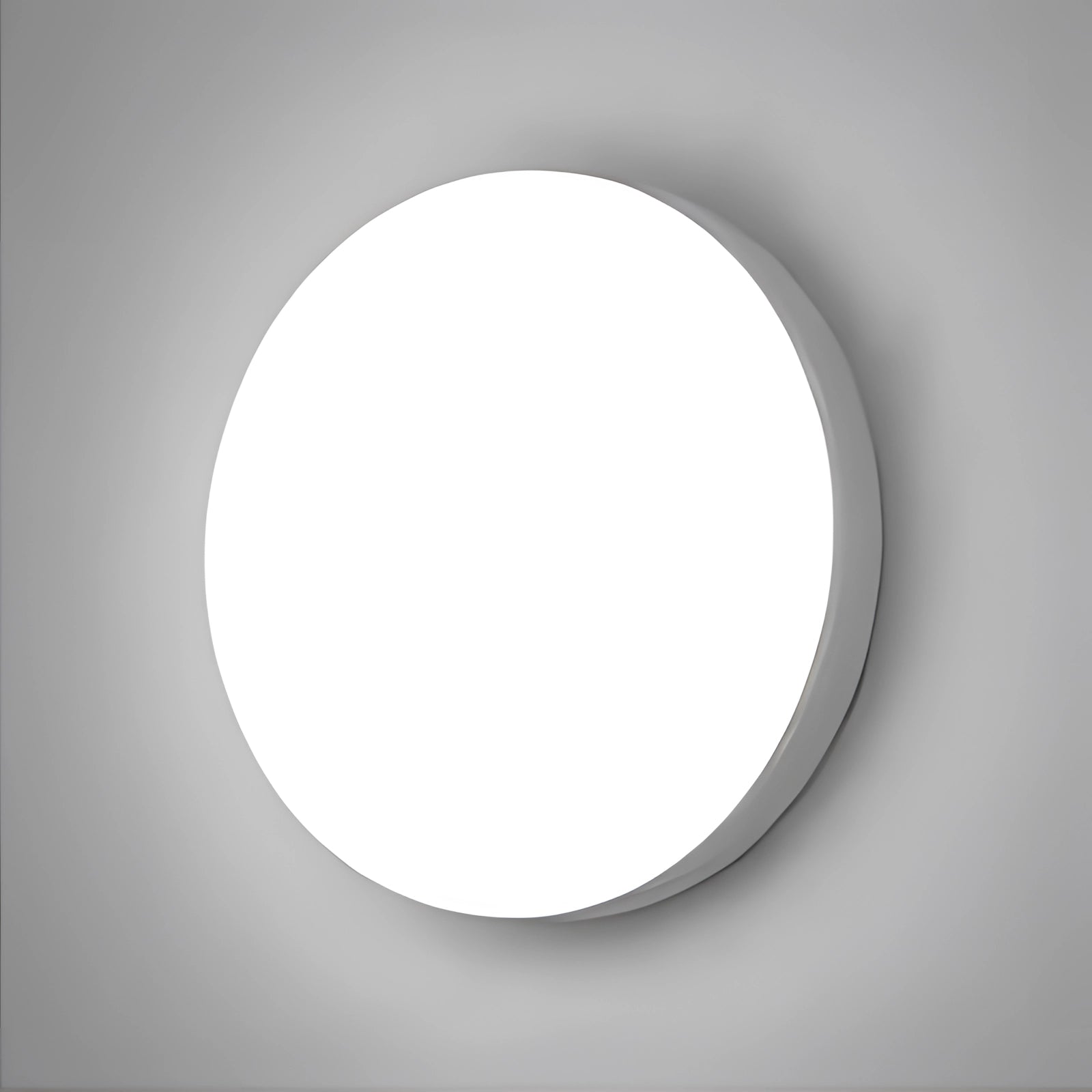 Modern circular wall light with a minimalist design, featuring a round shape and emitting a cold white glow, mounted on a ceiling.
