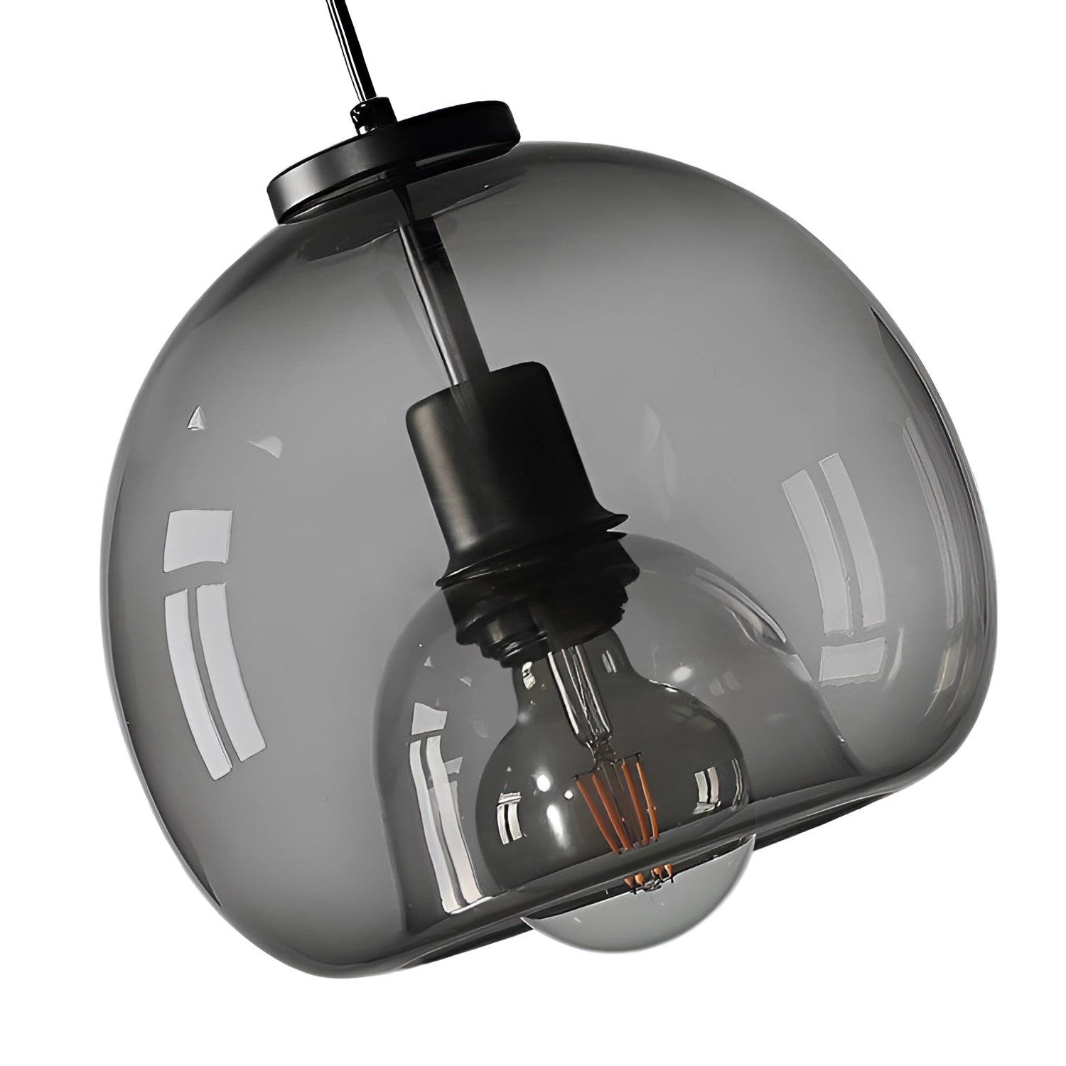Modern clear glass pendant lights with stylish globe design hanging from the ceiling.