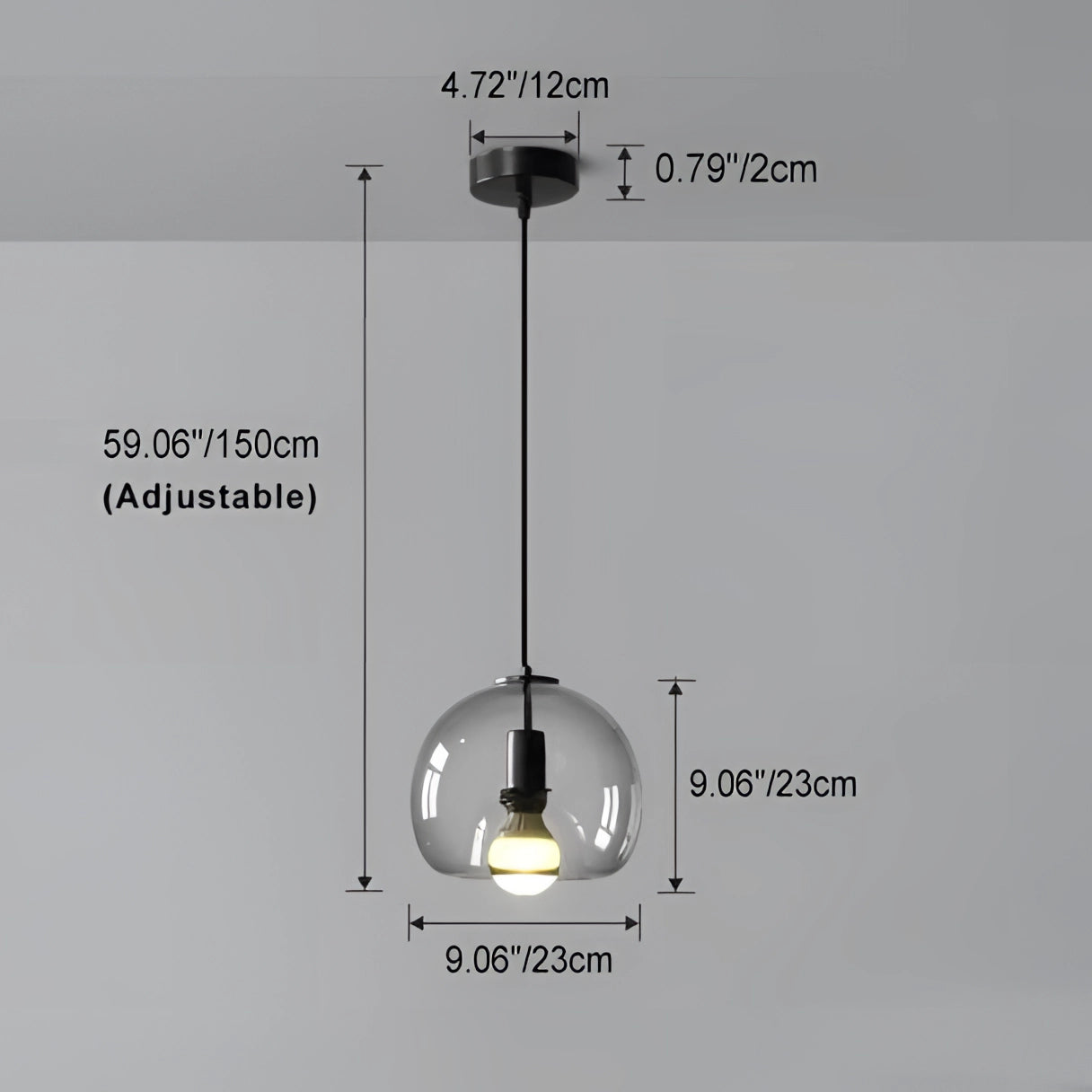 Modern clear glass pendant light with a stylish globe design, hanging from the ceiling, showing transparency and circular shape.