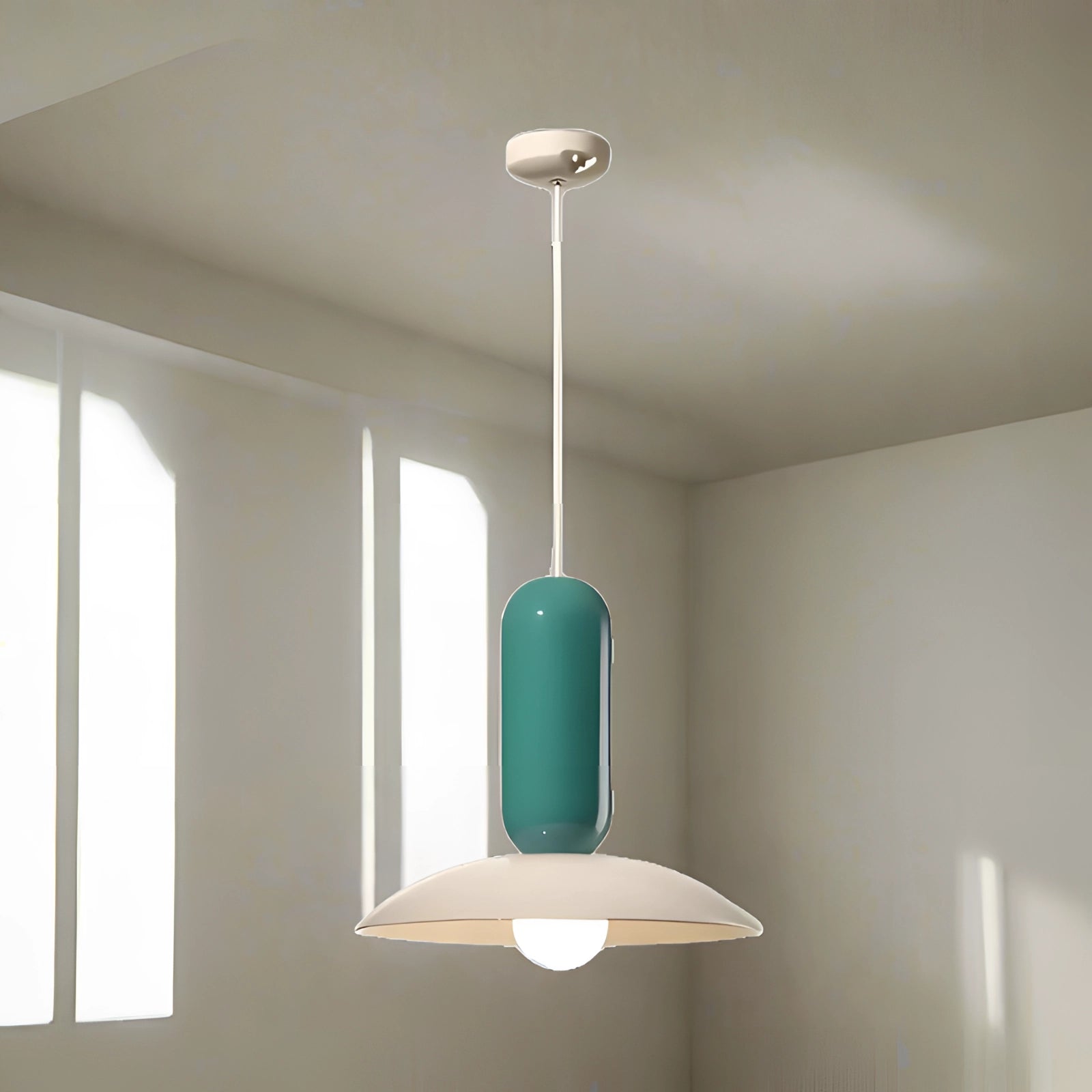 Modern green pendant light with wooden accents, featuring a Scandinavian design, hanging from the ceiling. The light has a sleek shade and measures 40 x 36 cm, suitable for kitchen or dining areas.