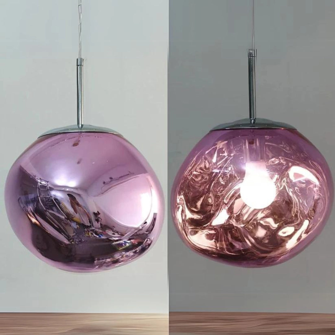 Modern copper glass cluster chandelier with pink and purple hues, featuring circular and ornamental design elements, constructed from metal and natural materials.