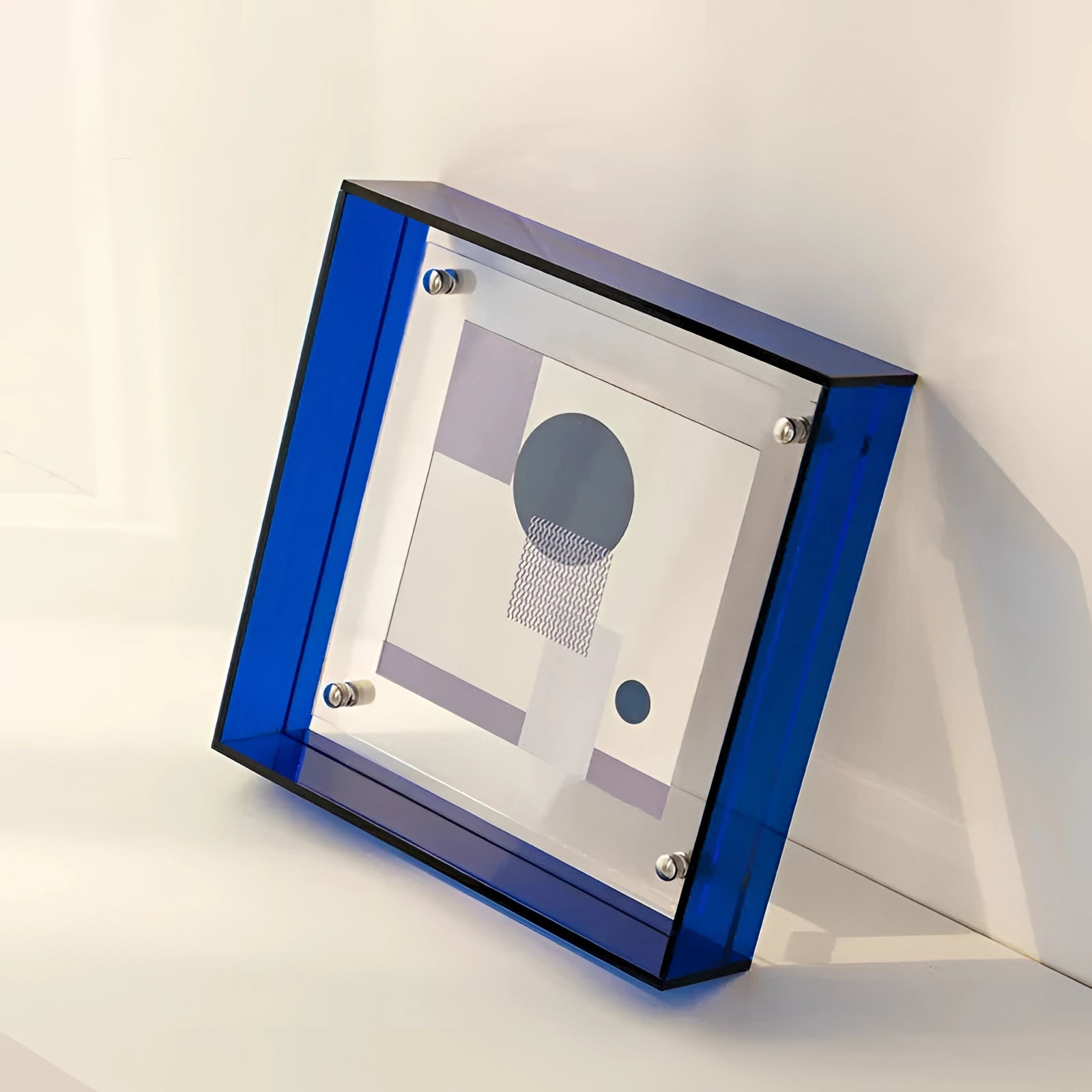 Modern decorative acrylic sculpture with a color block design in electric blue, measuring 21cm x 16cm, featuring a sleek rectangular shape.