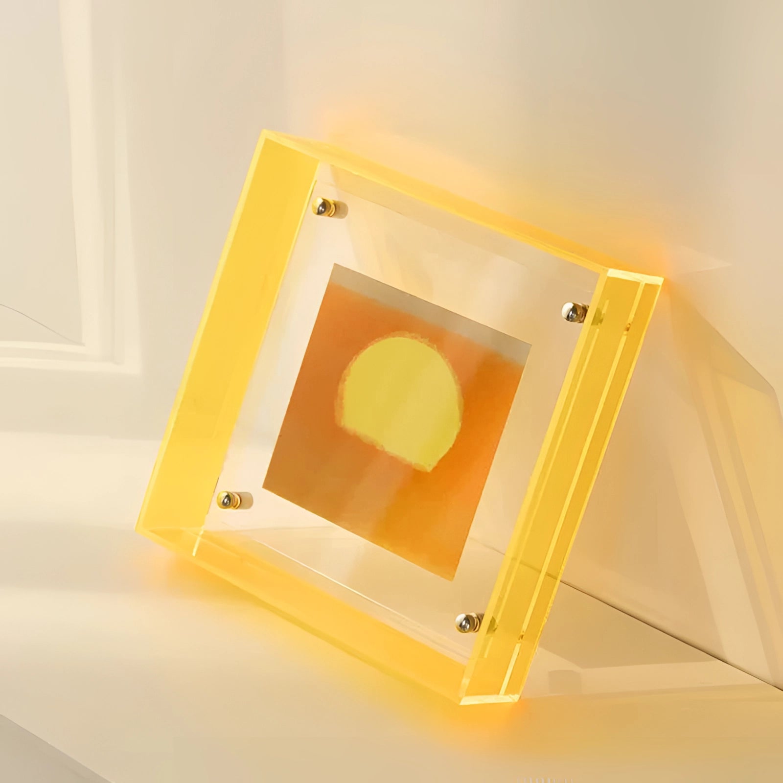 Modern decorative acrylic color block sculpture in yellow, measuring 21cm x 16cm, displayed against a wooden backdrop, highlighting its rectangular shape and luxurious design element suitable for home decor.