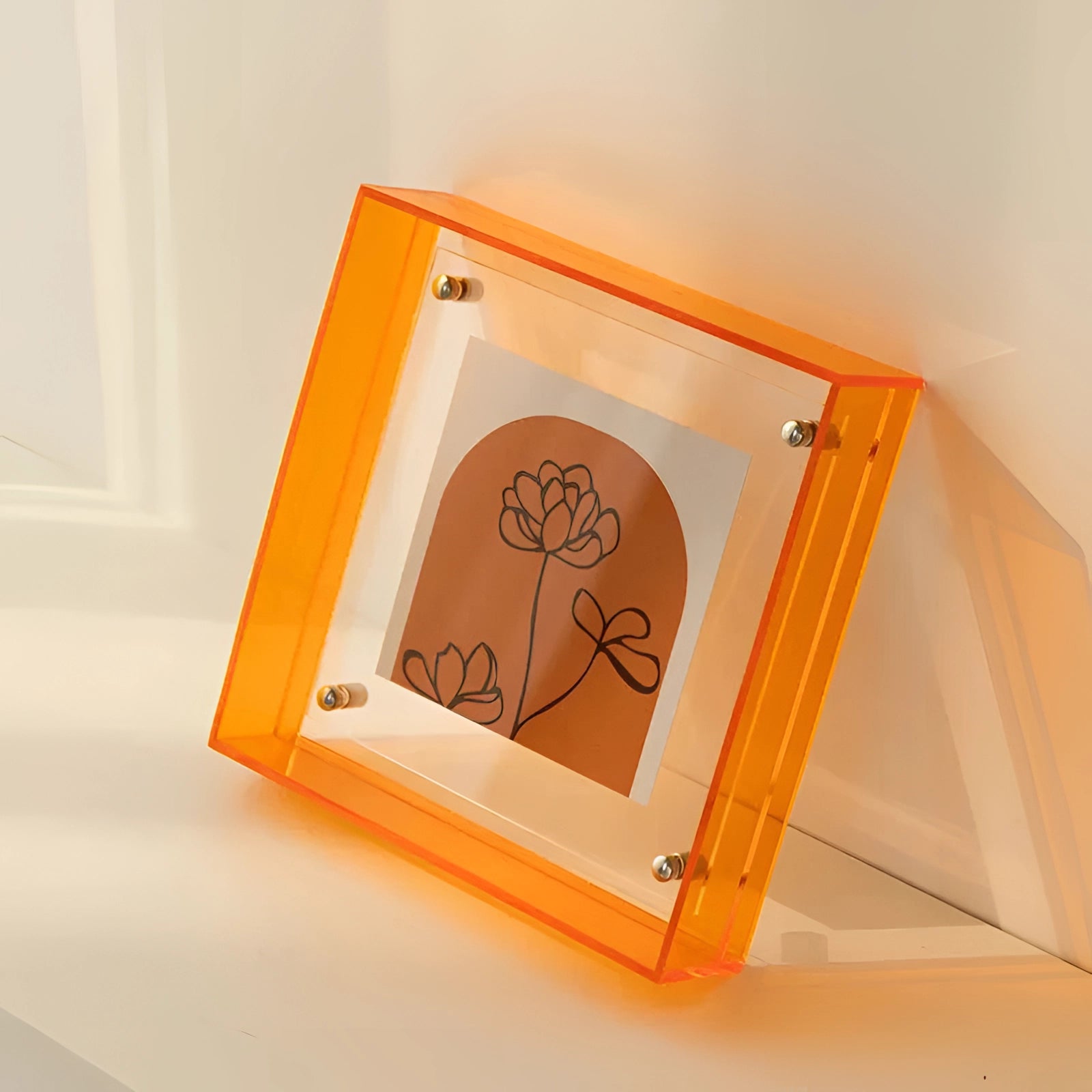 
Modern decorative acrylic sculpture in orange, featuring a rectangular color block design, measuring 21cm by 16cm. The piece is crafted in a luxury art style, showcasing a vibrant amber-orange hue.
