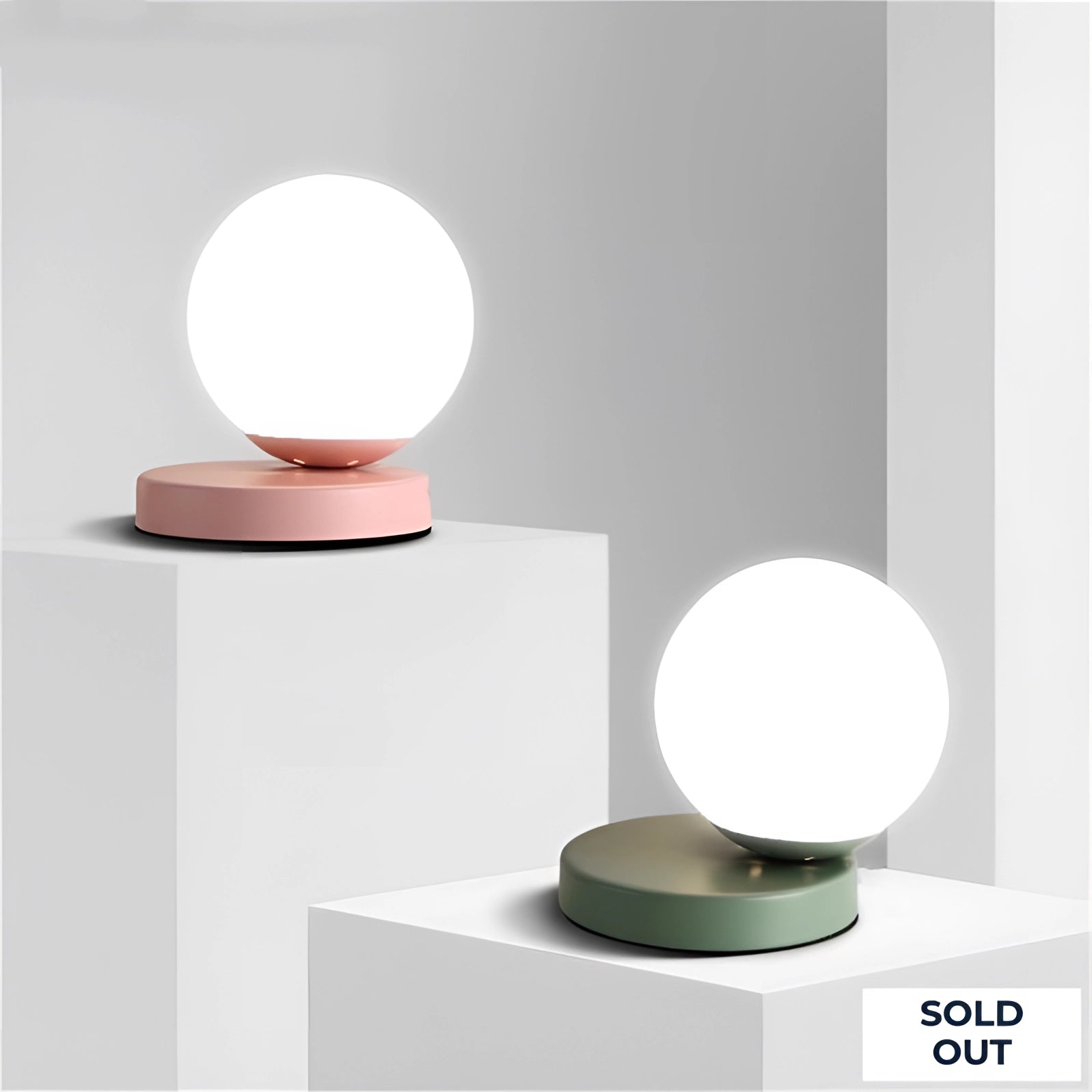 Modern designer orb lamp featuring a LED globe with a metallic base, exhibiting a circular shape with a sleek, artistic design and soft peach tints, suitable as a stylish ceiling lighting fixture.