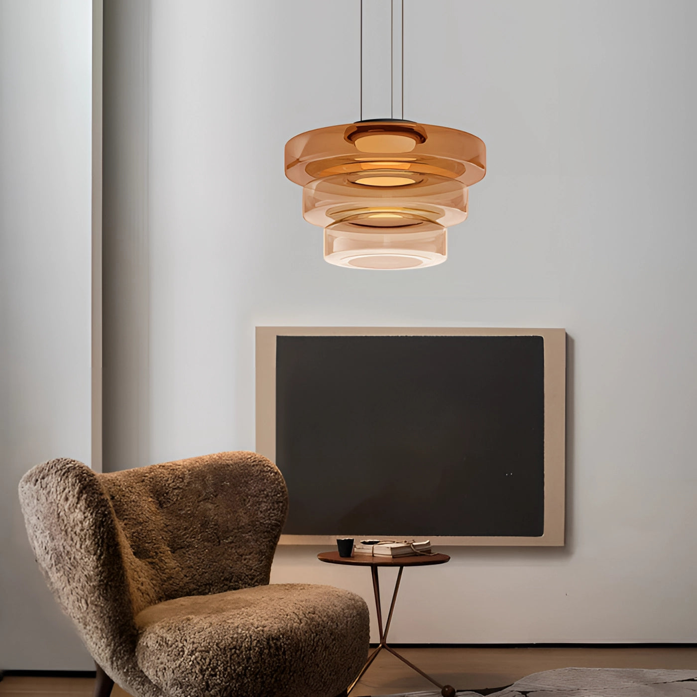 Modern designer pendant light hanging from the ceiling in a stylish interior space, with a focus on luxurious Bauhaus design elements.