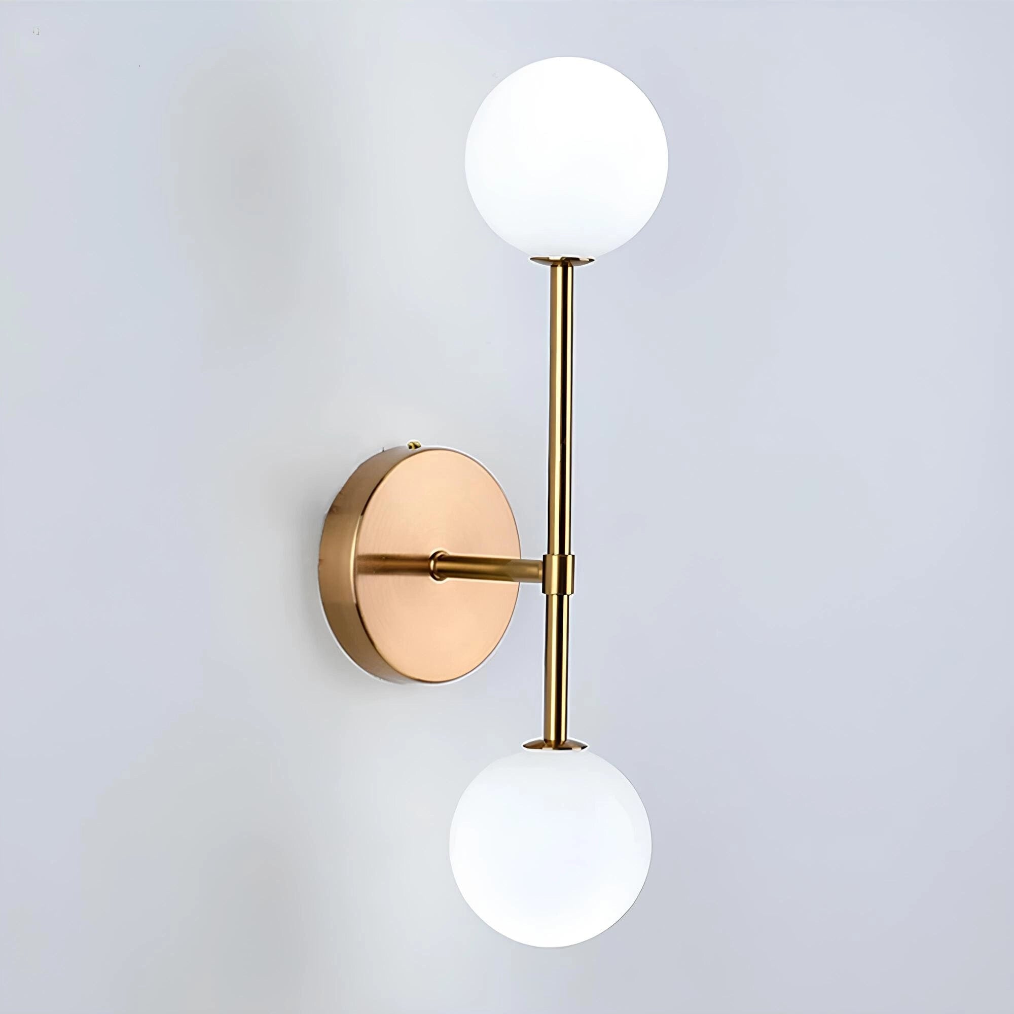 Modern minimalist double globe wall sconce featuring two spherical LED lights with a metal and wood design, suitable for bedroom lighting.